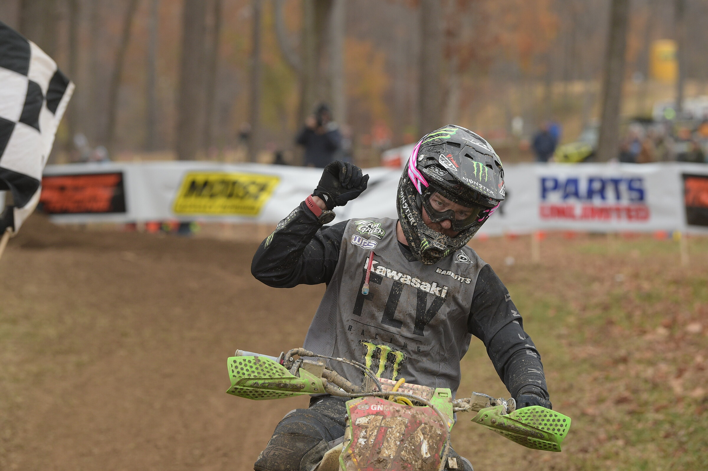 Josh Strang taking the Ironman GNCC overall checkered flag.