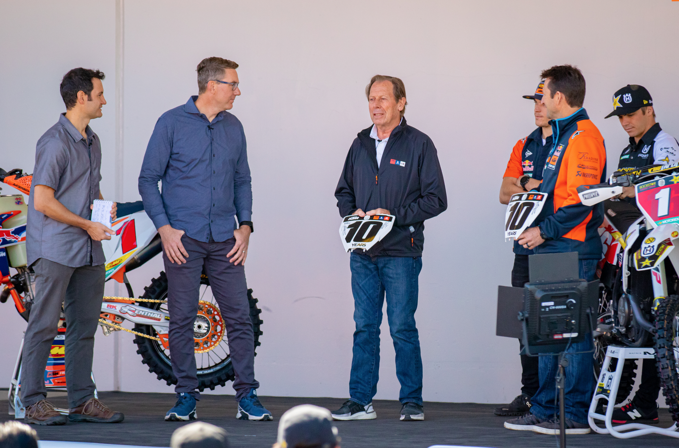 John Hinz presents 10 Year number plates to Roger De Coster and Ian Harrison.
