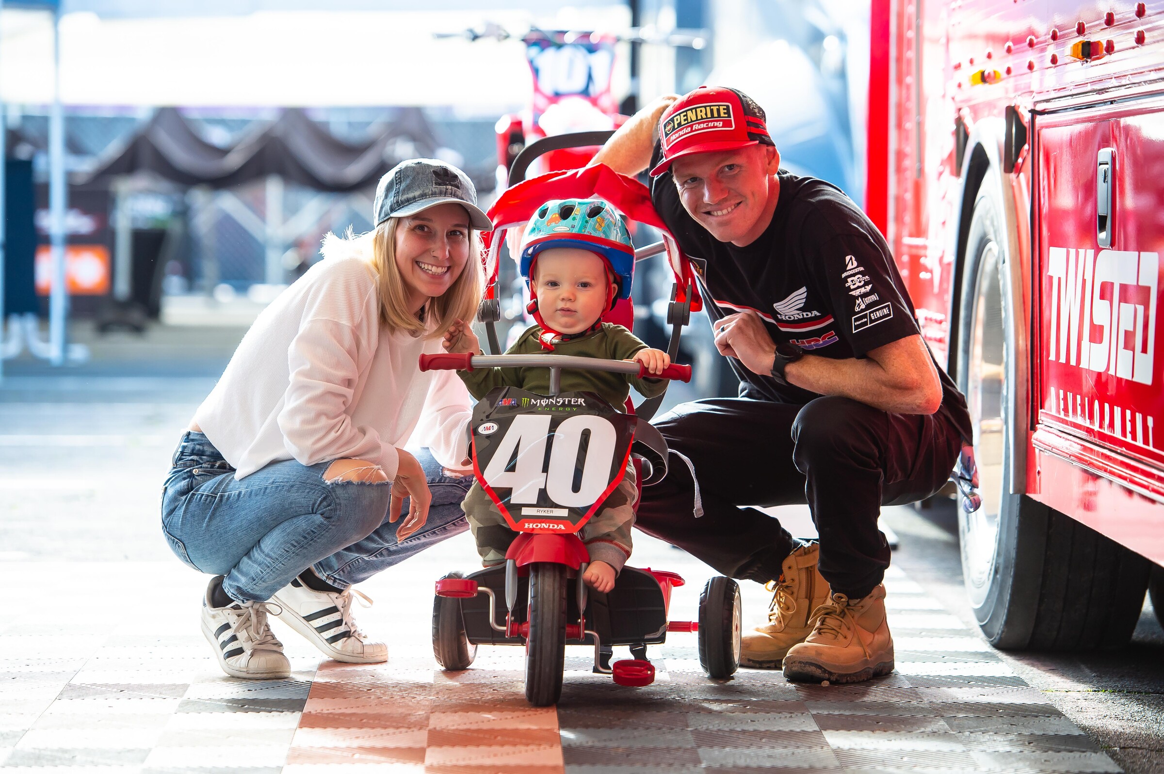 Mitchell Oldenburg (right) with his wife Alexandria and son Ryker.