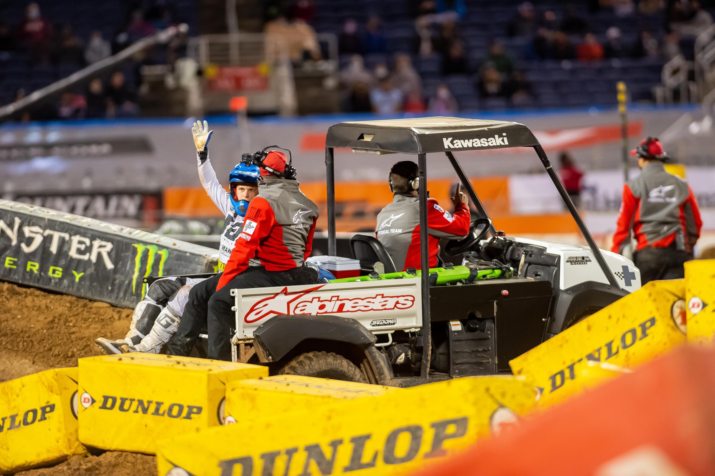 Alex Martin being carted off the track after a crash early in the 250SX main event.