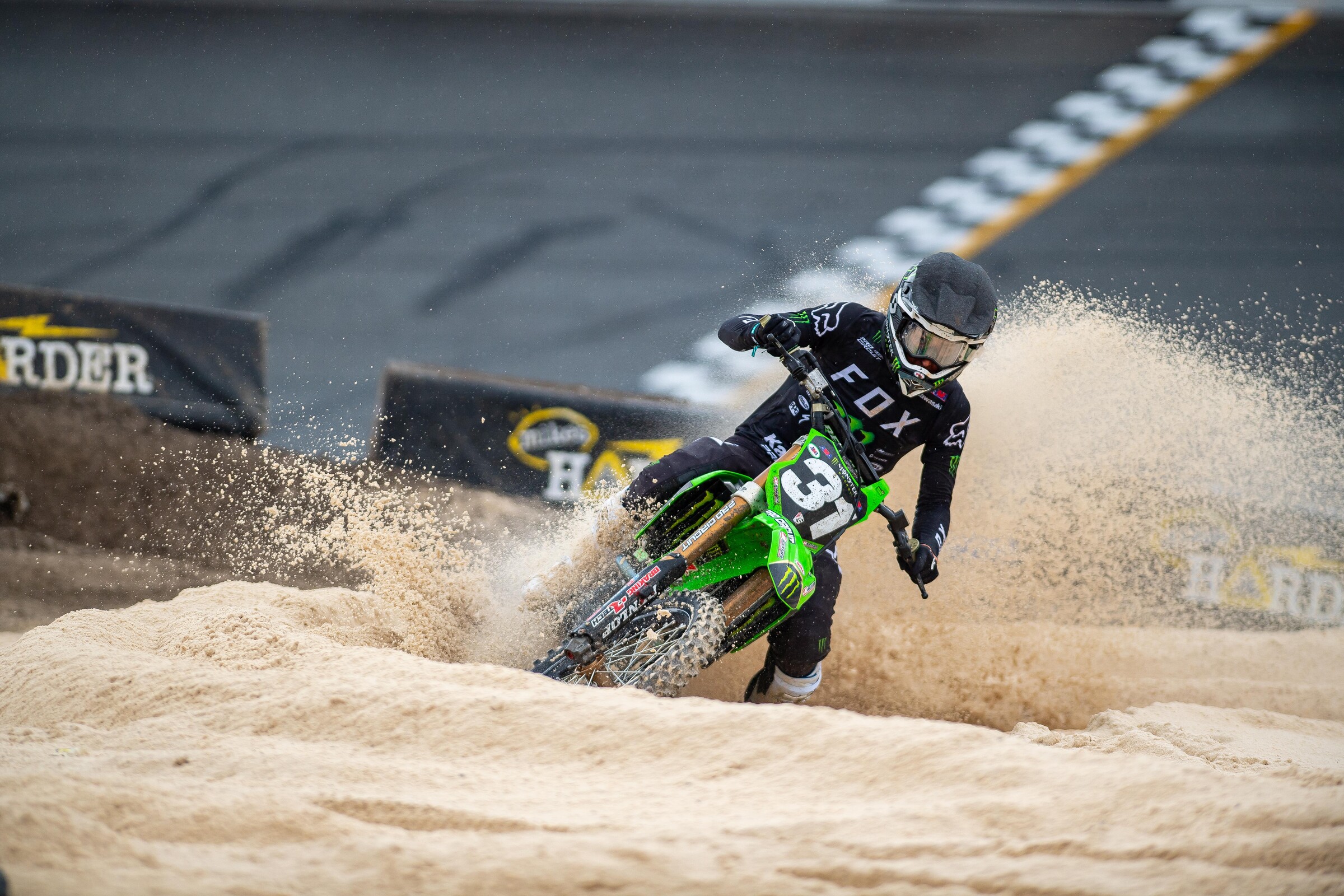 Cameron McAdoo burying his Monster Energy/Pro Circuit Kawasaki in the Florida sand.