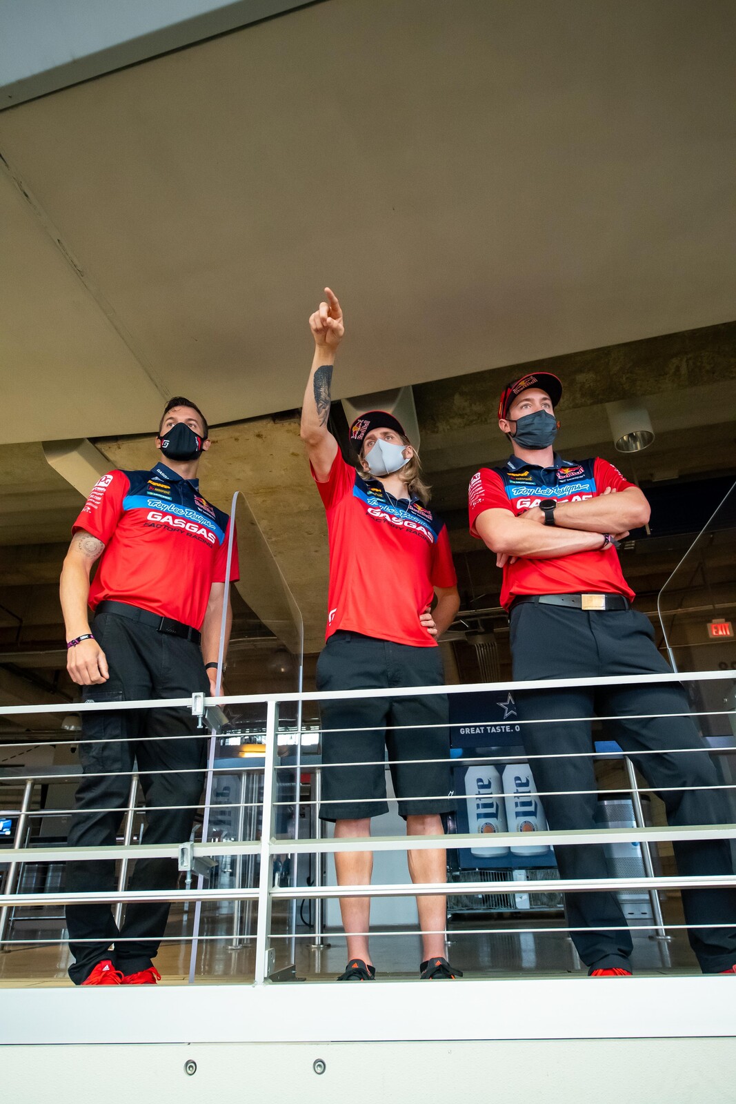 Justin Barcia (middle) and Troy Lee Designs/Red Bull/GasGas Factory Racing team members viewing the track.