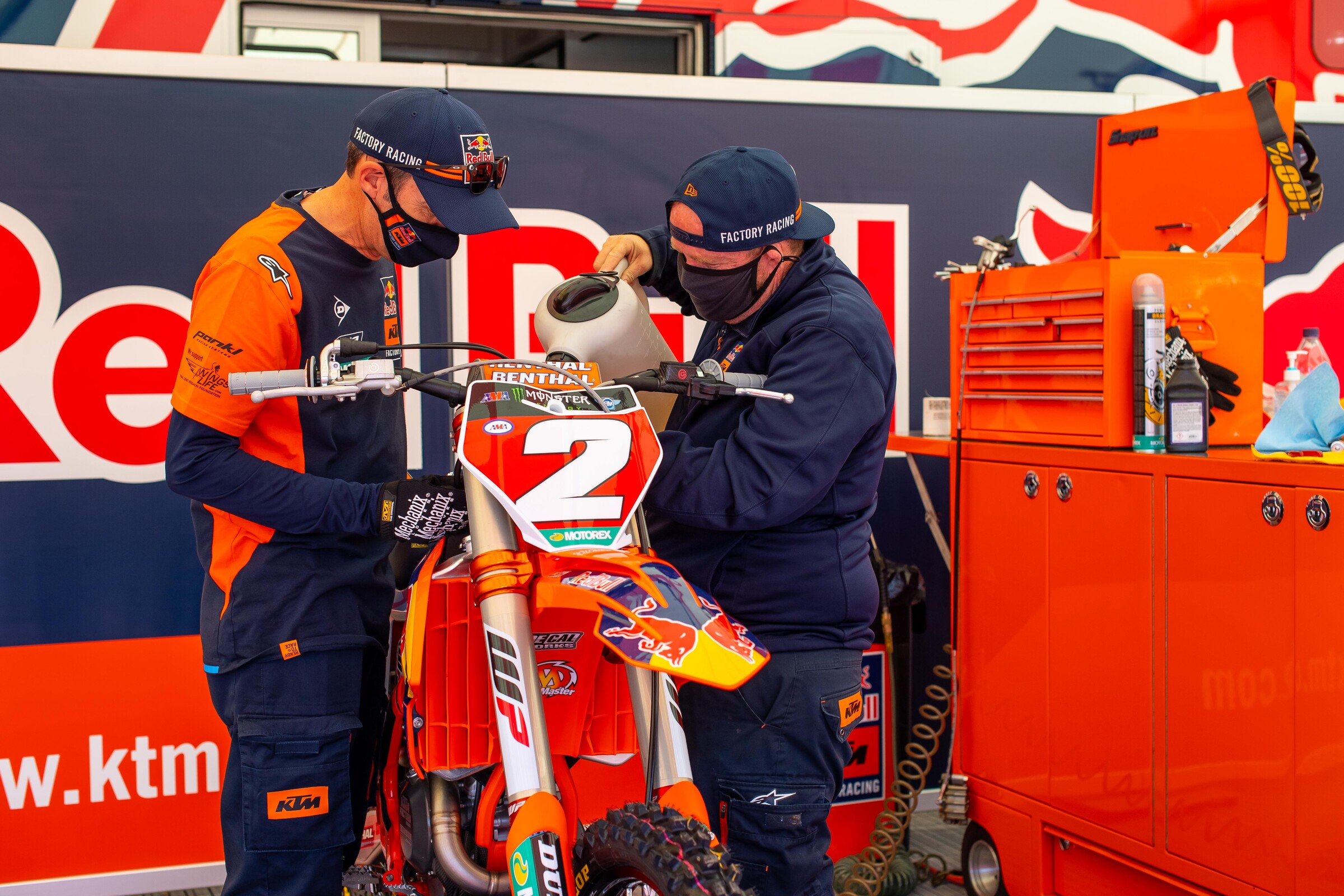 Mechanics Carlos Rivera (left) and Frankie Latham dialing in Webb's bike on race day. Latham can help with Webb's bike since his rider, Marvin Musquin, is out for today following a crash on Saturday.