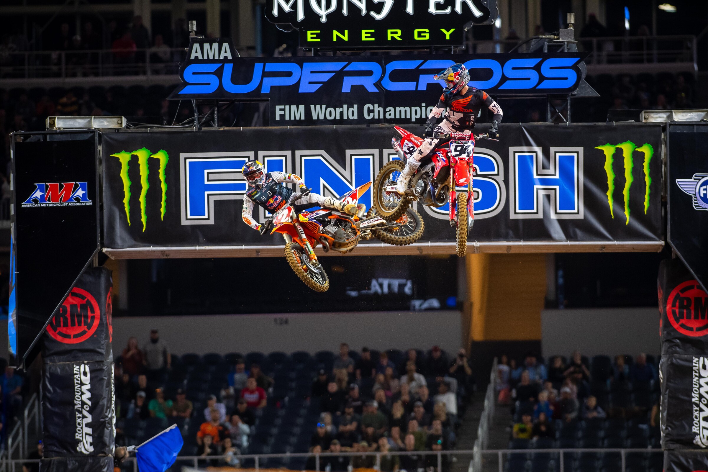 Roczen and Webb over the finish line jump.