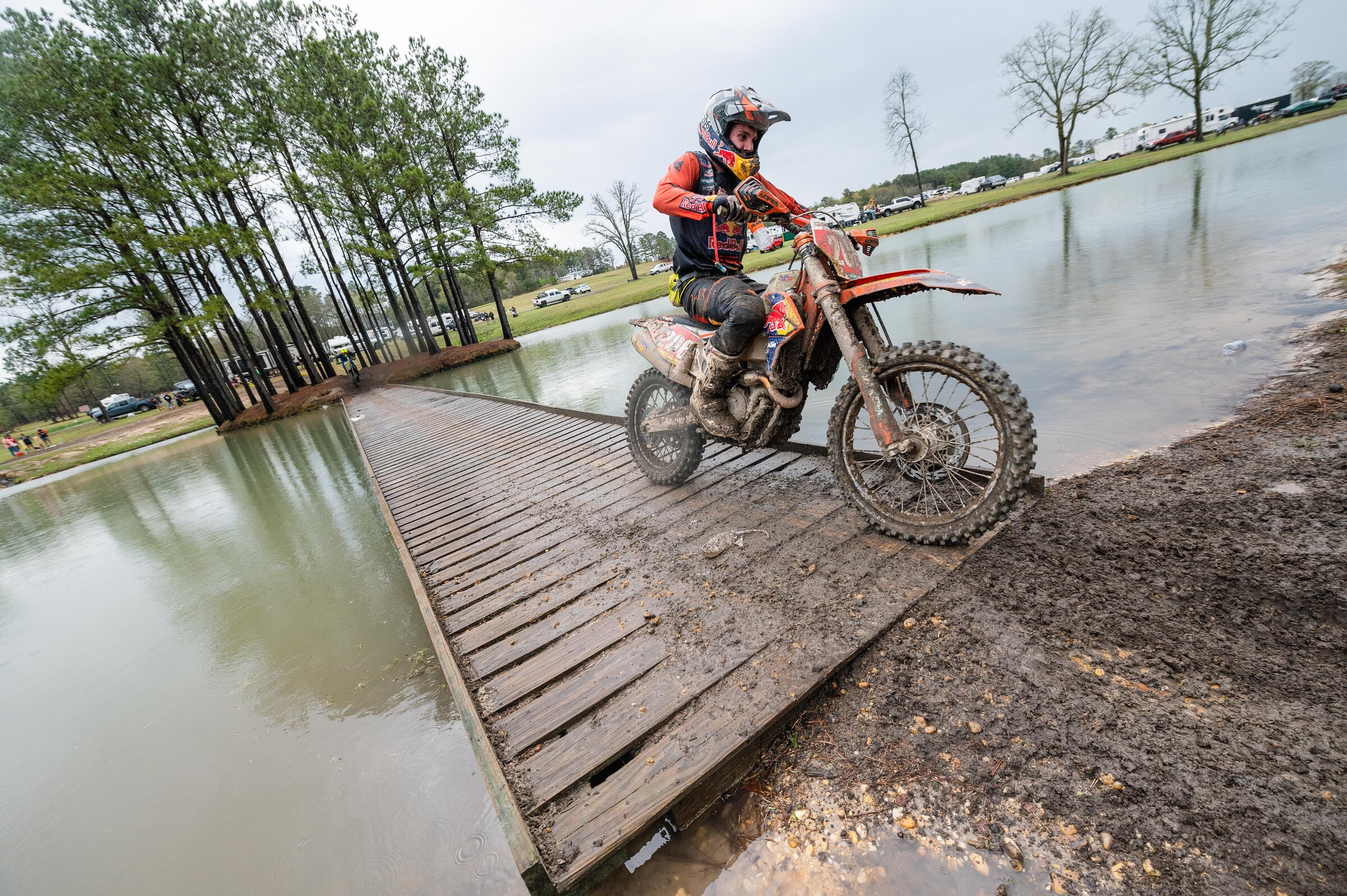 Josh Toth rides over a bridge above one of the many ponds.