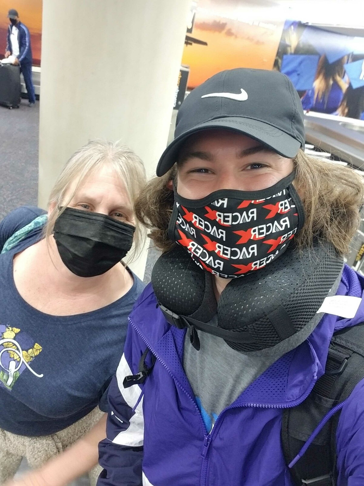 Mitch and his new flight buddy Lisa grabbing their bags in Connecticut.