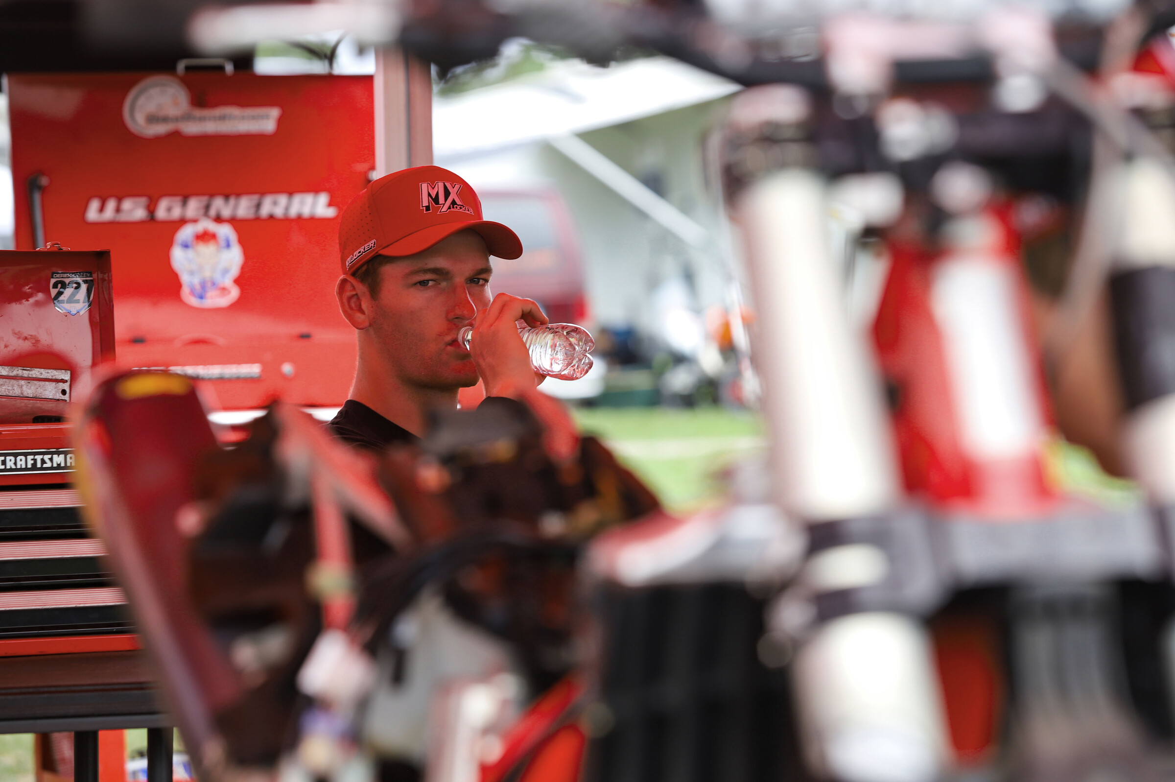 Derek Kelley stays hydrated as the TPJ crew works on his GasGas MC 250F.