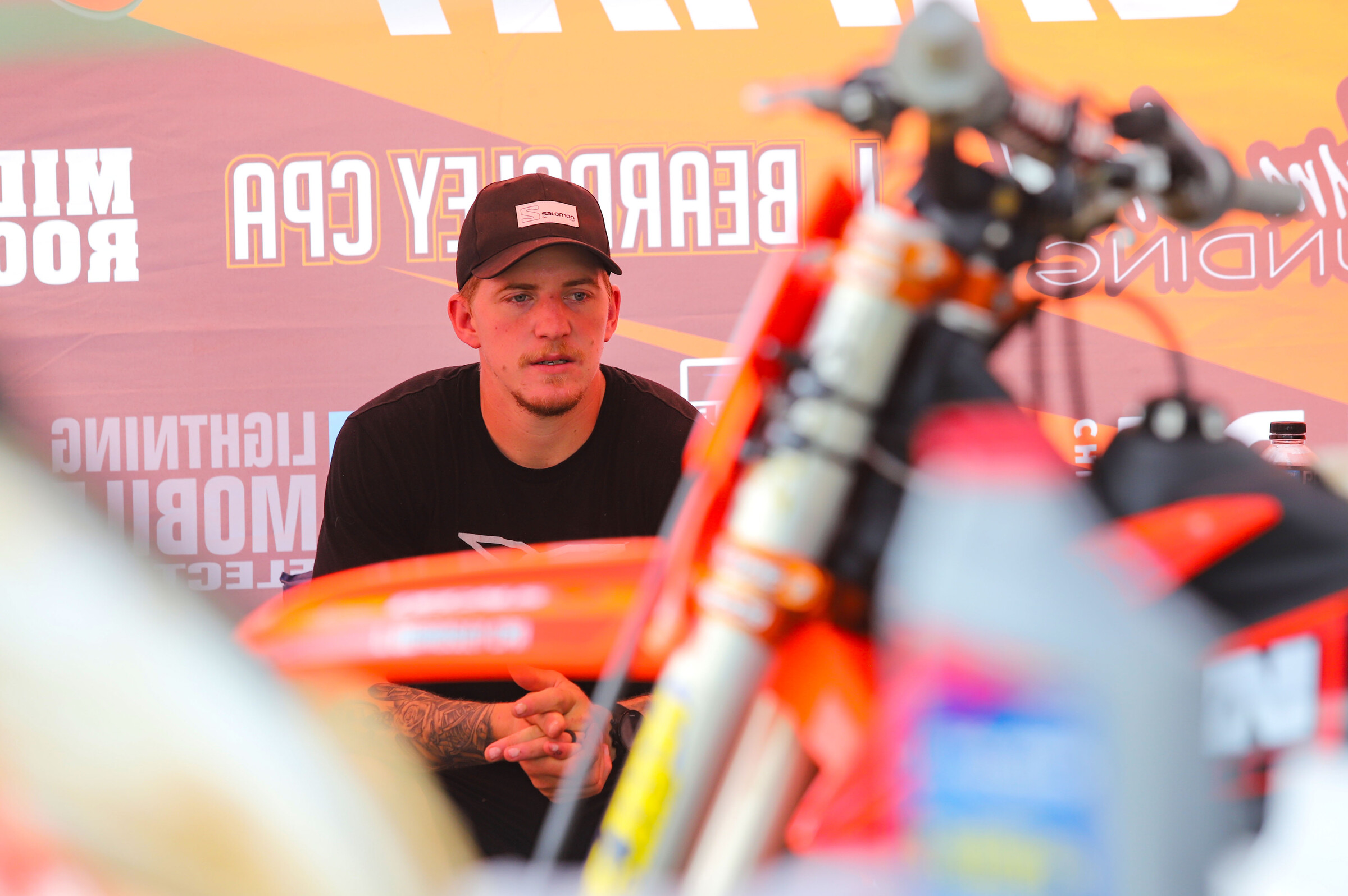 Ben LaMay talks with his crew in the shade.