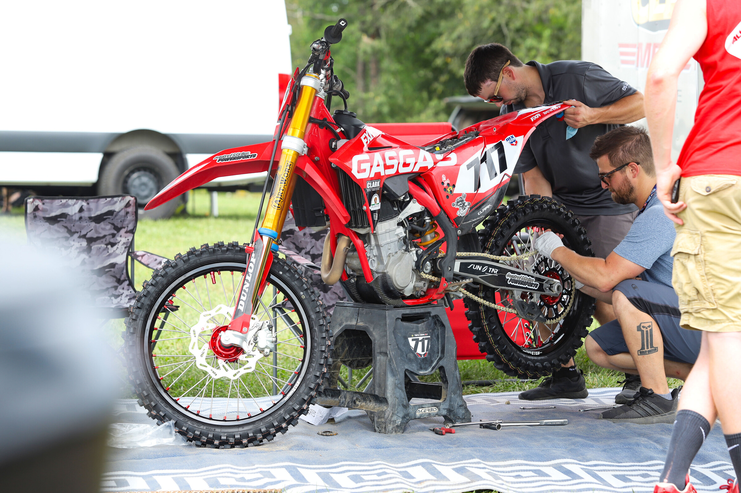 William Clark’s crew works on his GasGas MC 450F.