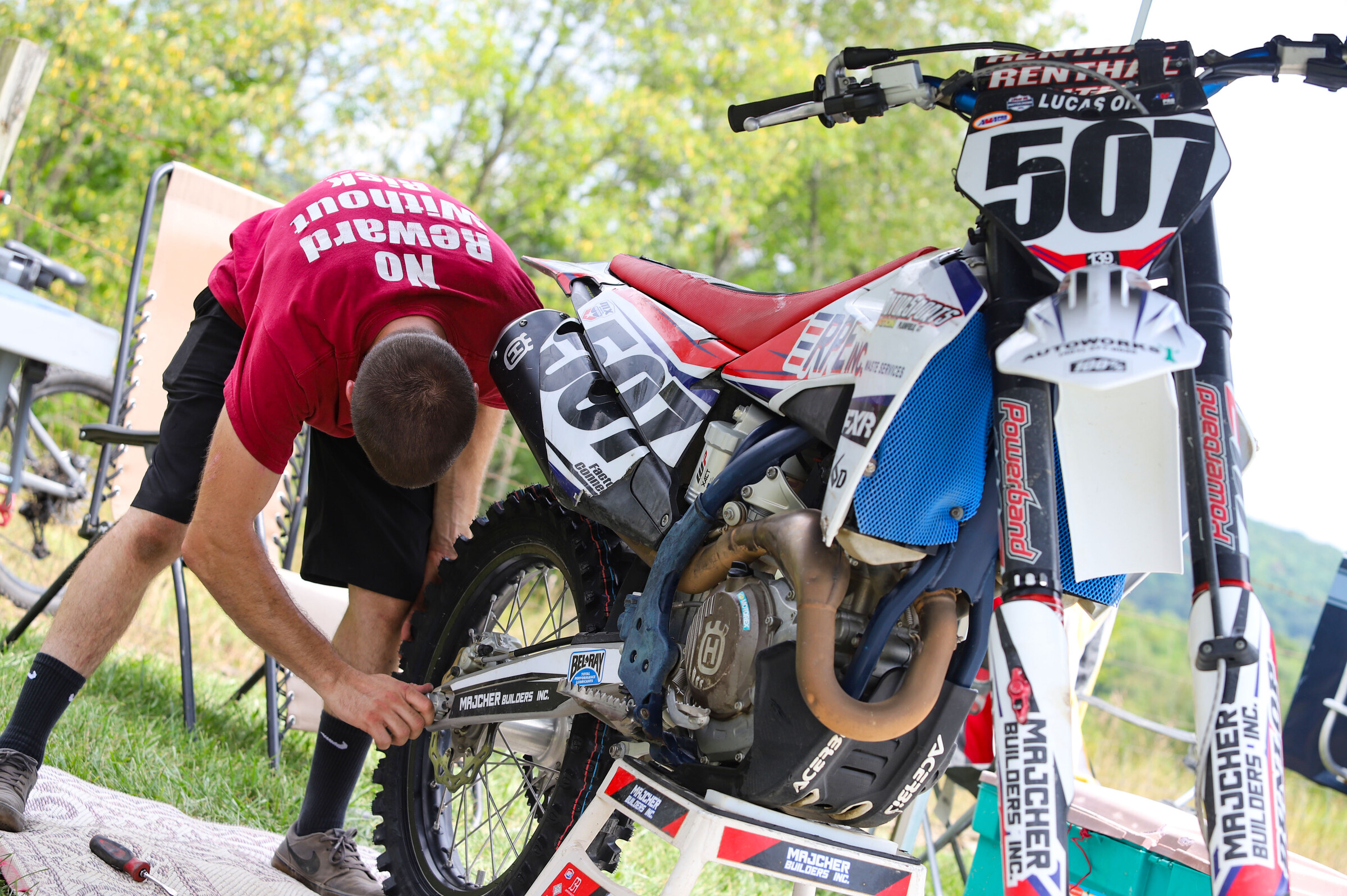 TJ Lanphear tightens his rear wheel.