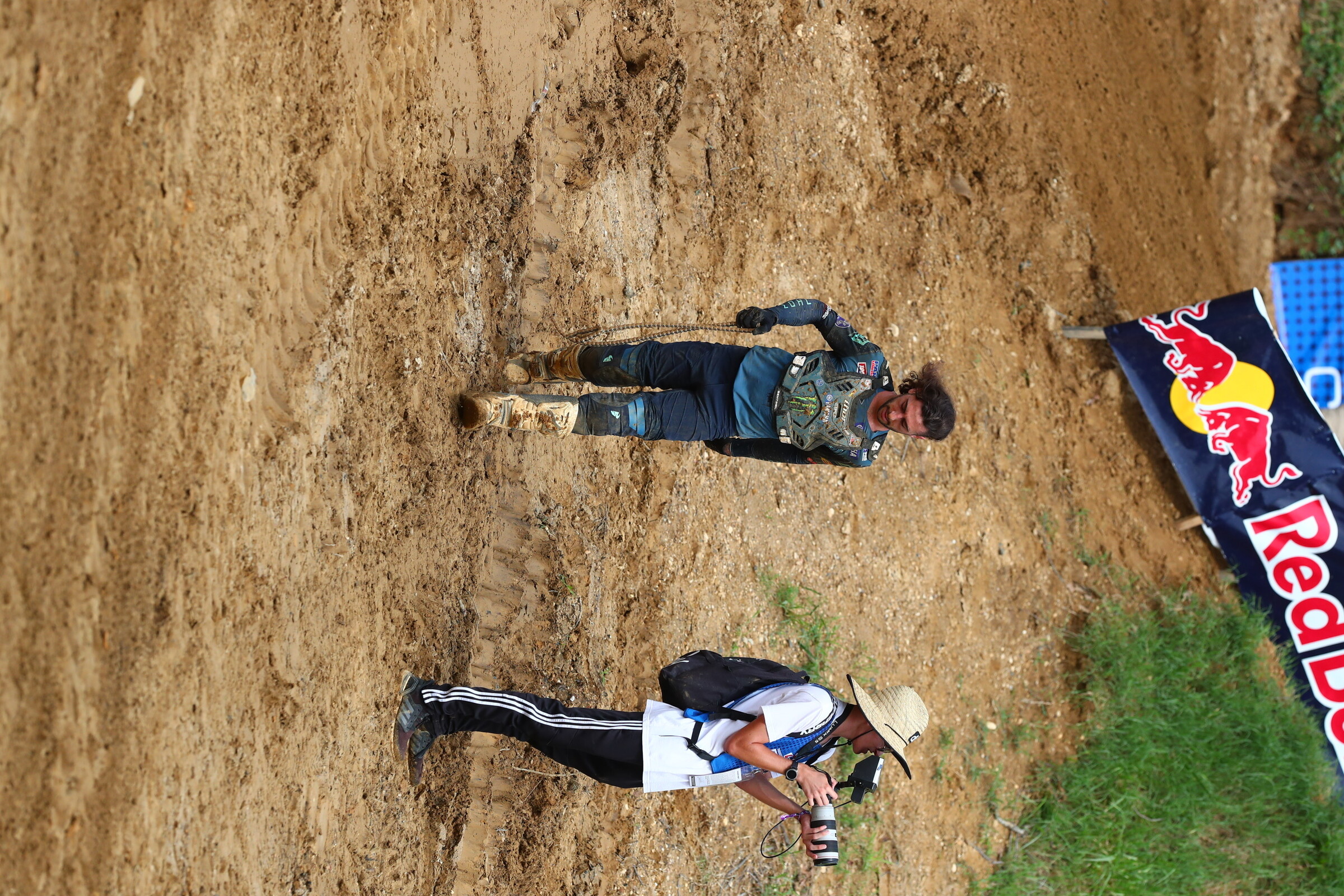 Ferrandis carries his broken chain off the track.