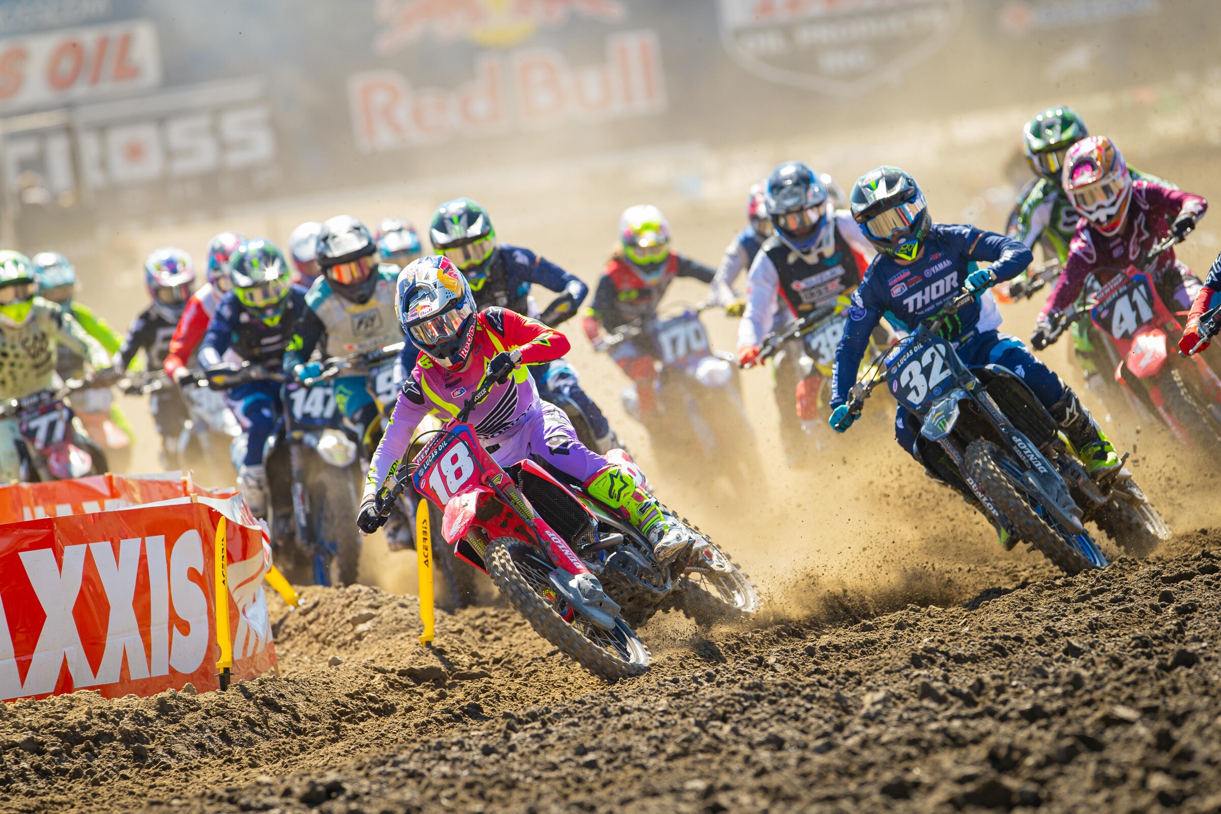 Jett Lawrence and Justin Cooper battle into the first turn at Fox Raceway.