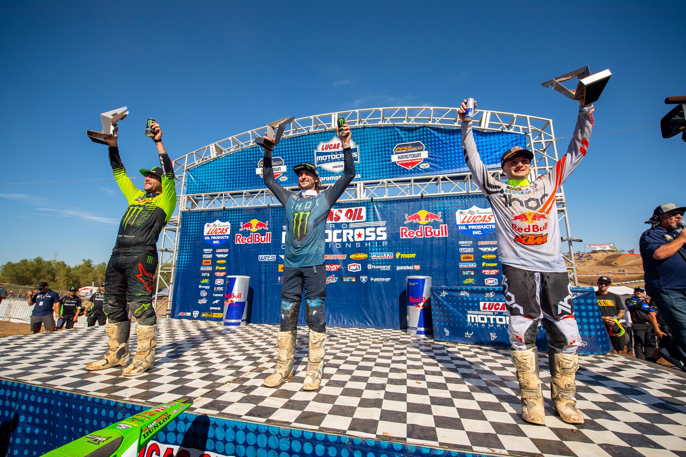 The 2021 Hangtown Motocross Classic 250 Class overall podium: Dylan Ferrandis (middle, 1-3 for first overall), Eli Tomac (left, 4-1 for second overall), and Cooper Webb (right, 3-2 for third overall).