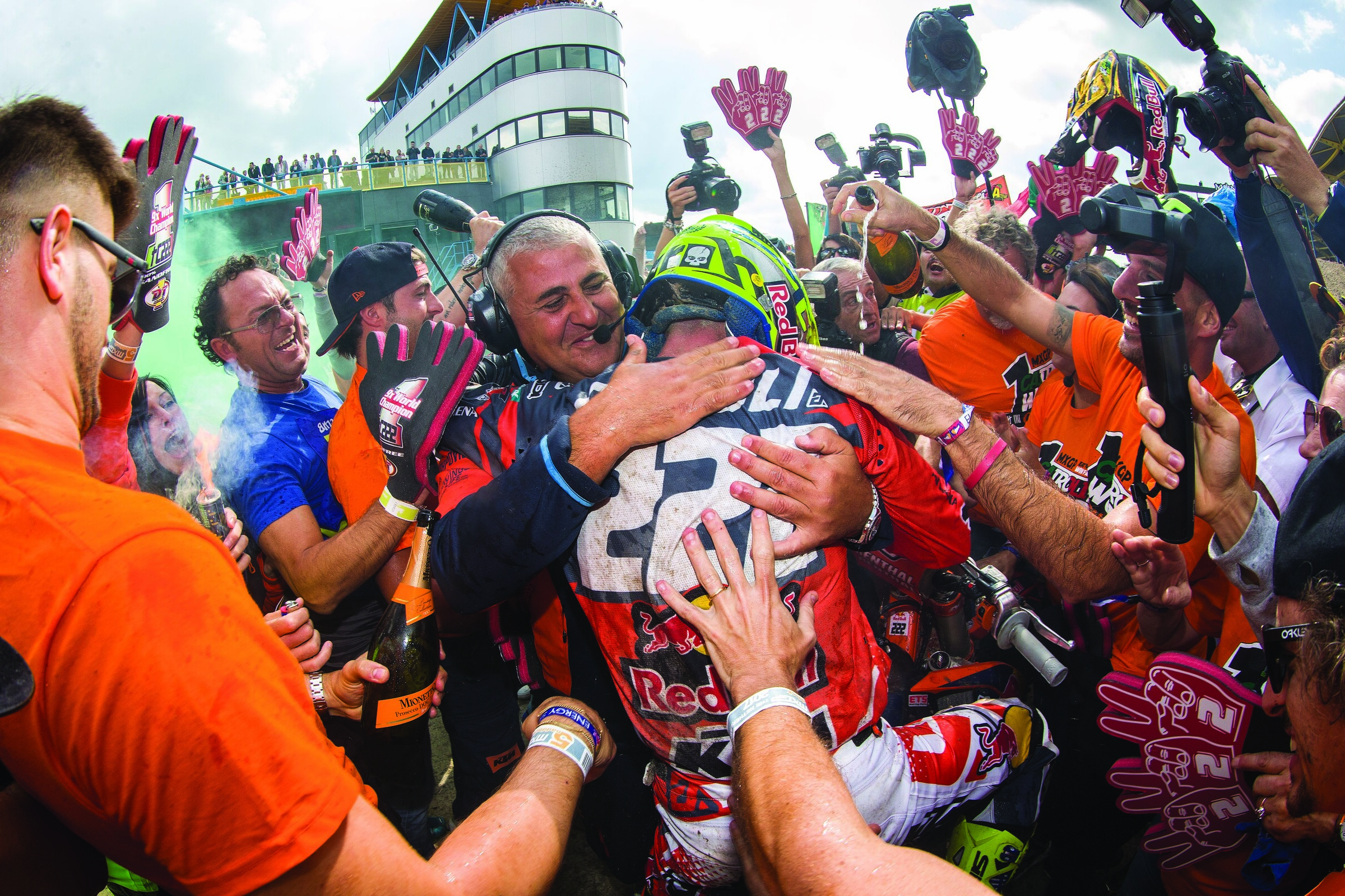 Cairoli is hugged by long-time team owner Claudio De Carli after clinching the 2017 MXGP World Championship.