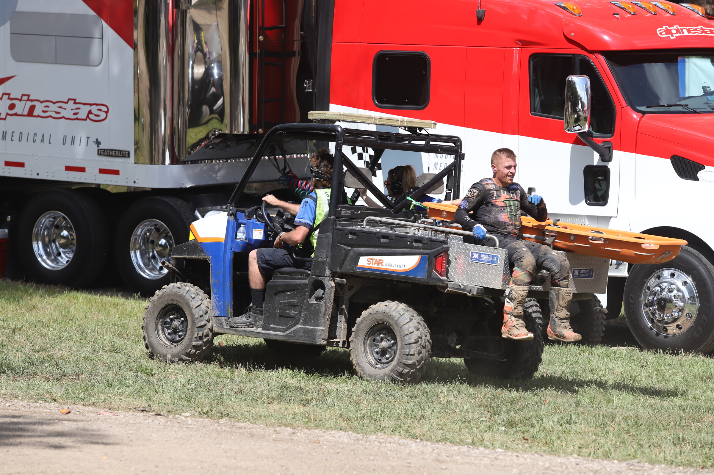 Martin riding back to the medical rig with the Alpinestars medical crew after his crash at Ironman Raceway.