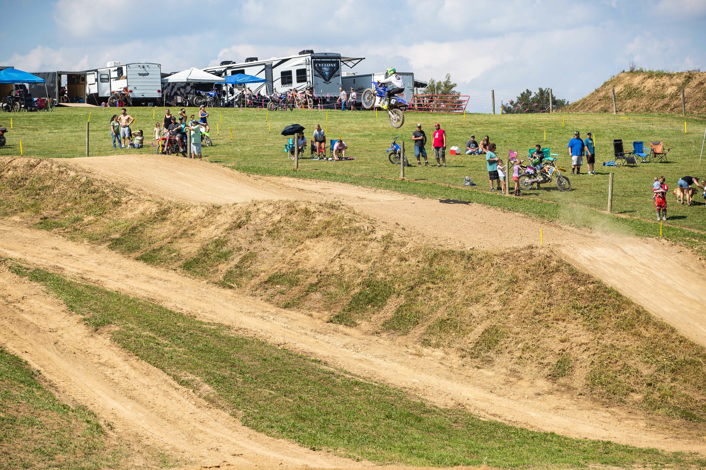 Racer X's Ryan McLeod sends the massive uphill triple on his two-stroke.
