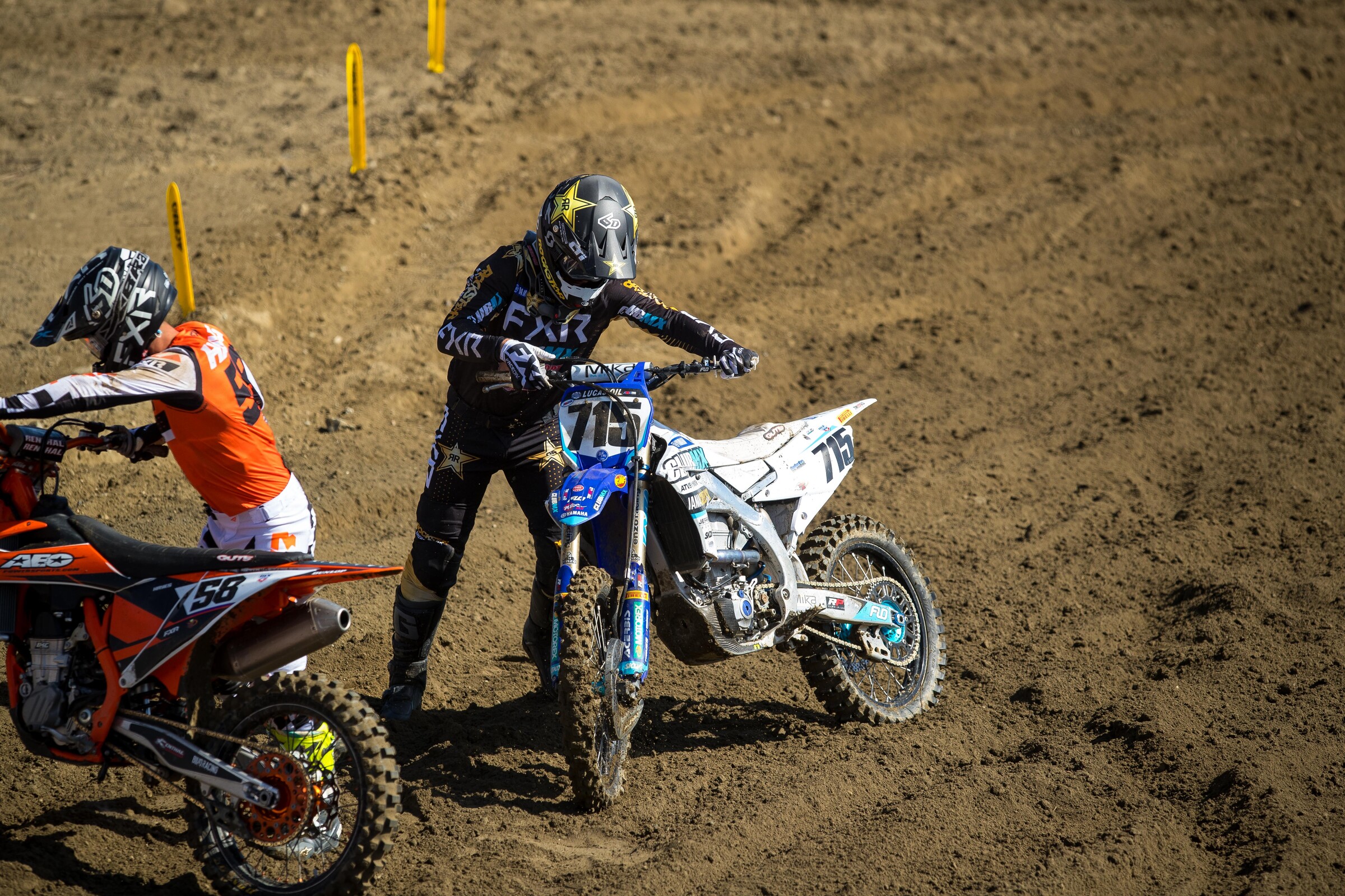 Is this Phil checking his bike setup mid-moto?