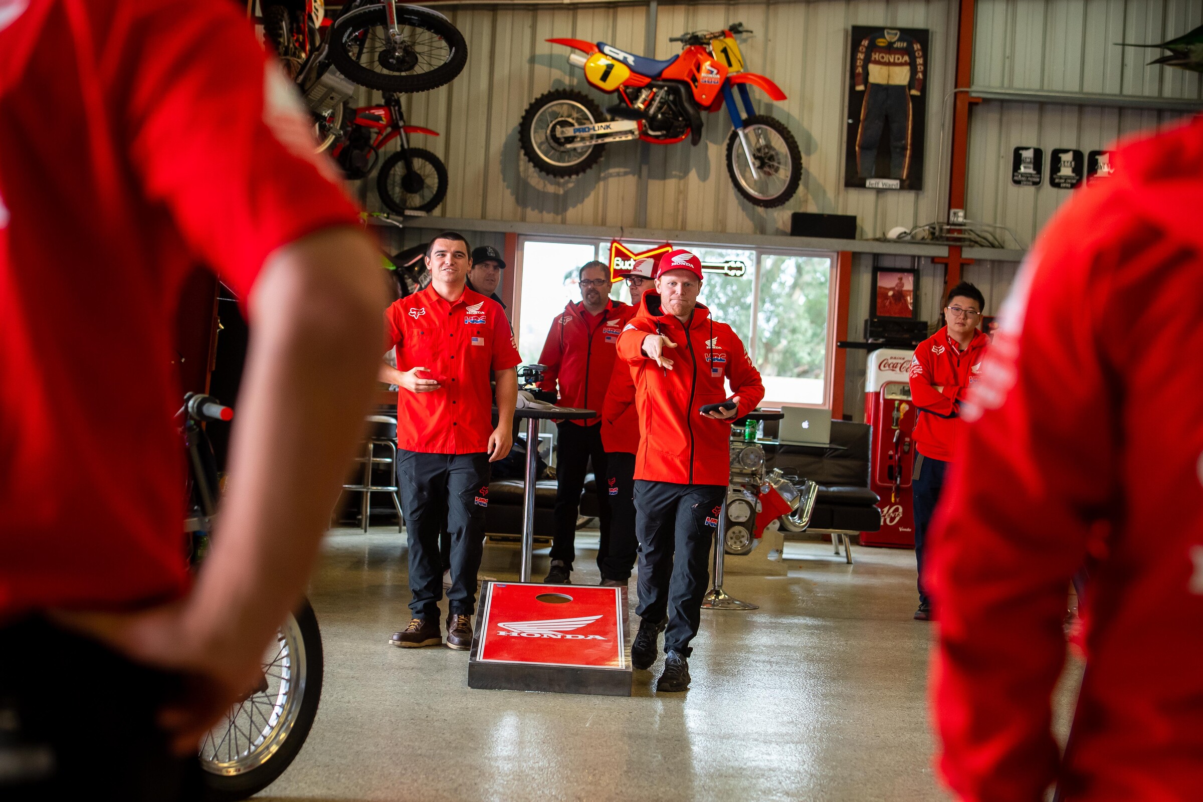 The Honda HRC team playing corn hole.