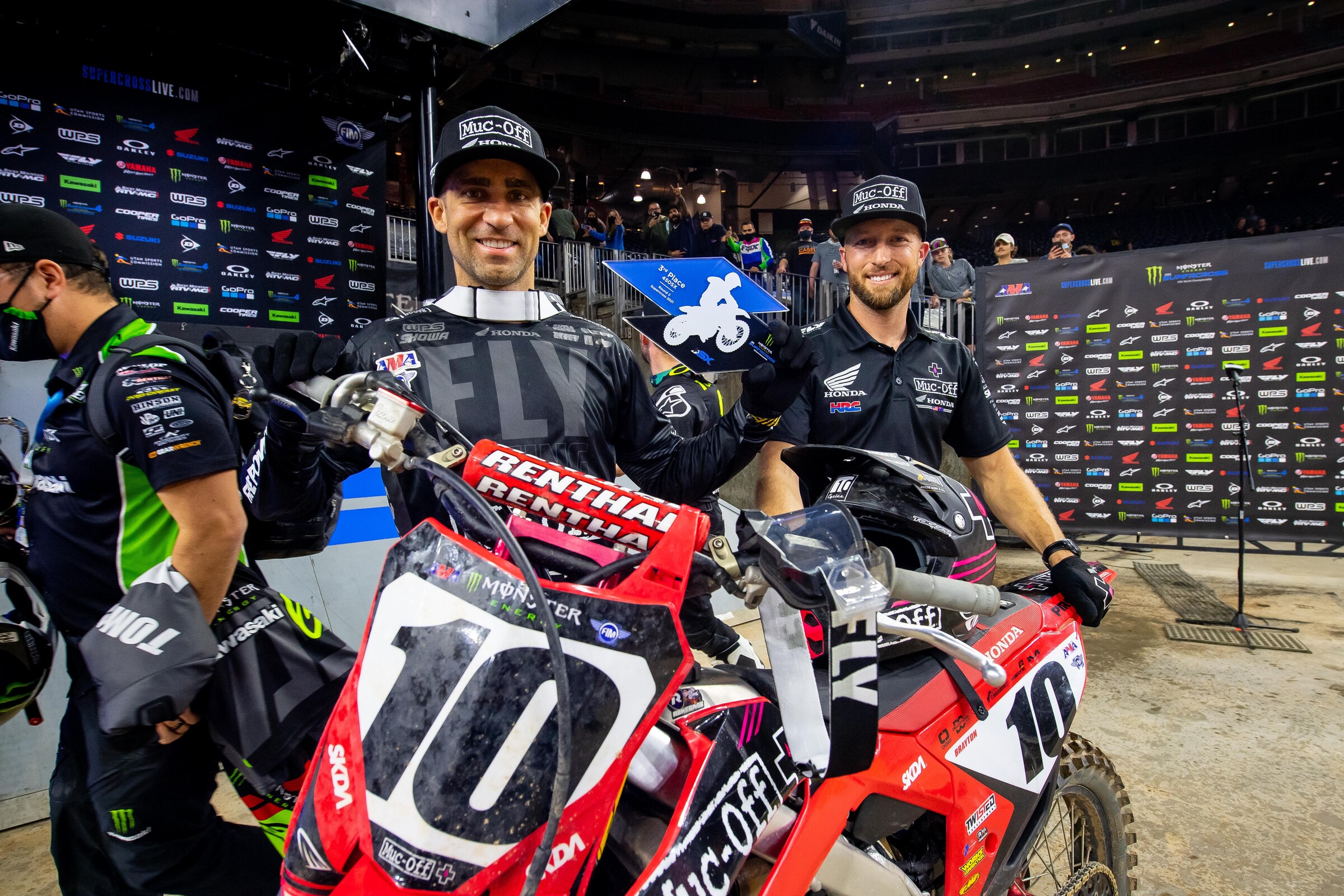 Justin Brayton and mechanic Brent Duffy celebrate a podium finish at the 2021 Houston 2 Supercross.