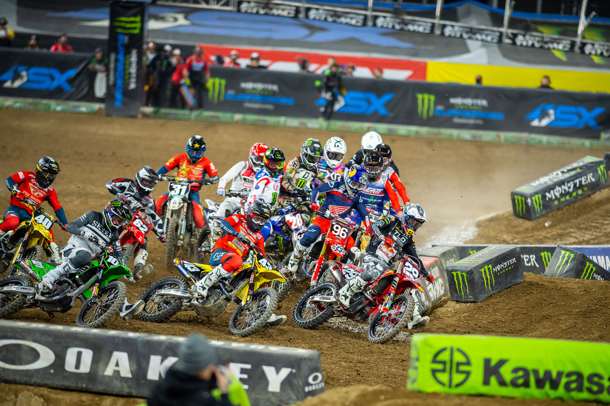 Christian Craig (#28) gets sideways into turn one and a massive pileup ensues.