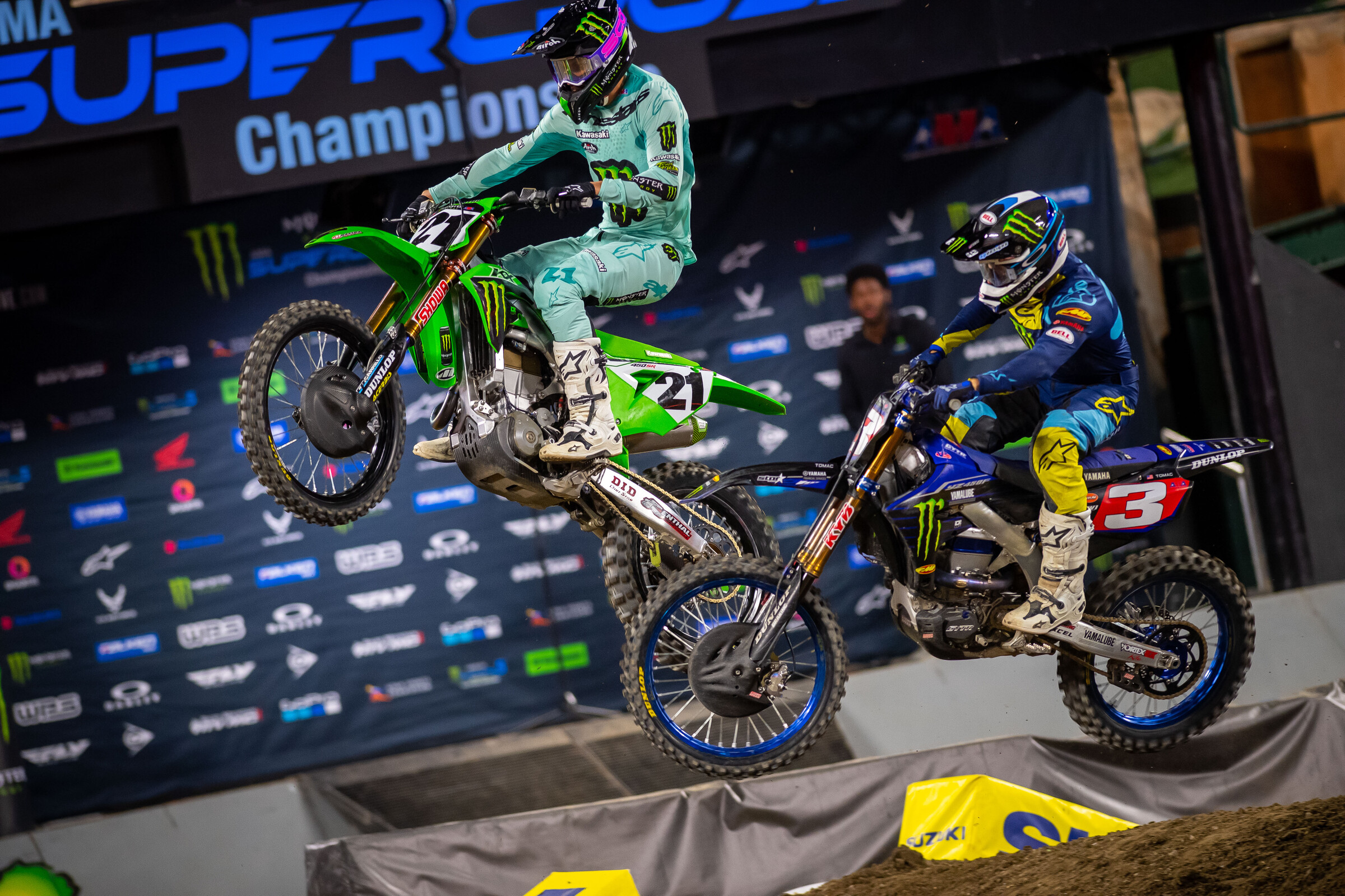 Jason Anderson and Eli Tomac battling for the lead at Anaheim 3.