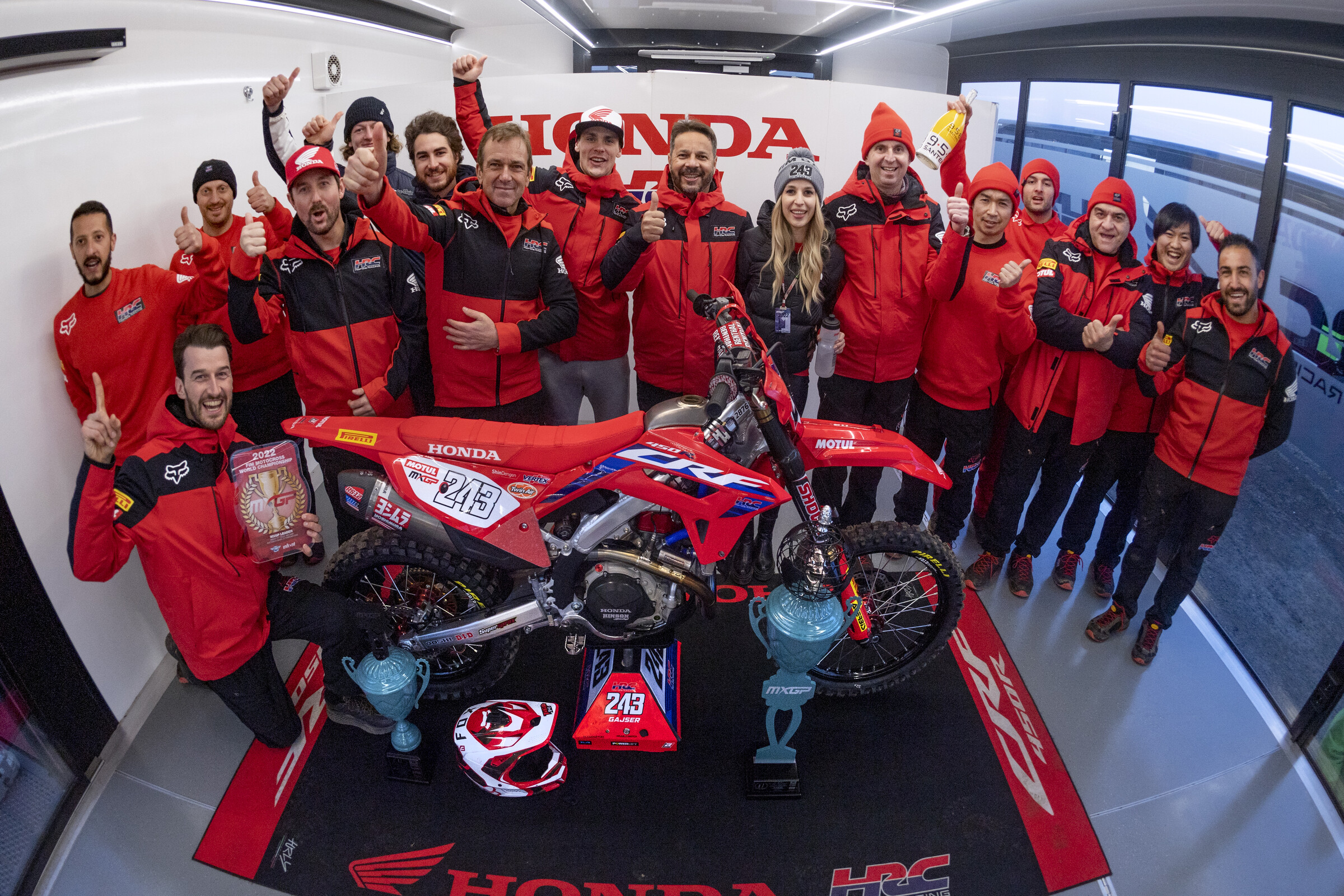 Tim Gajser and the Honda HRC crew celebrating his overall win at the 2022 MXGP season opener.