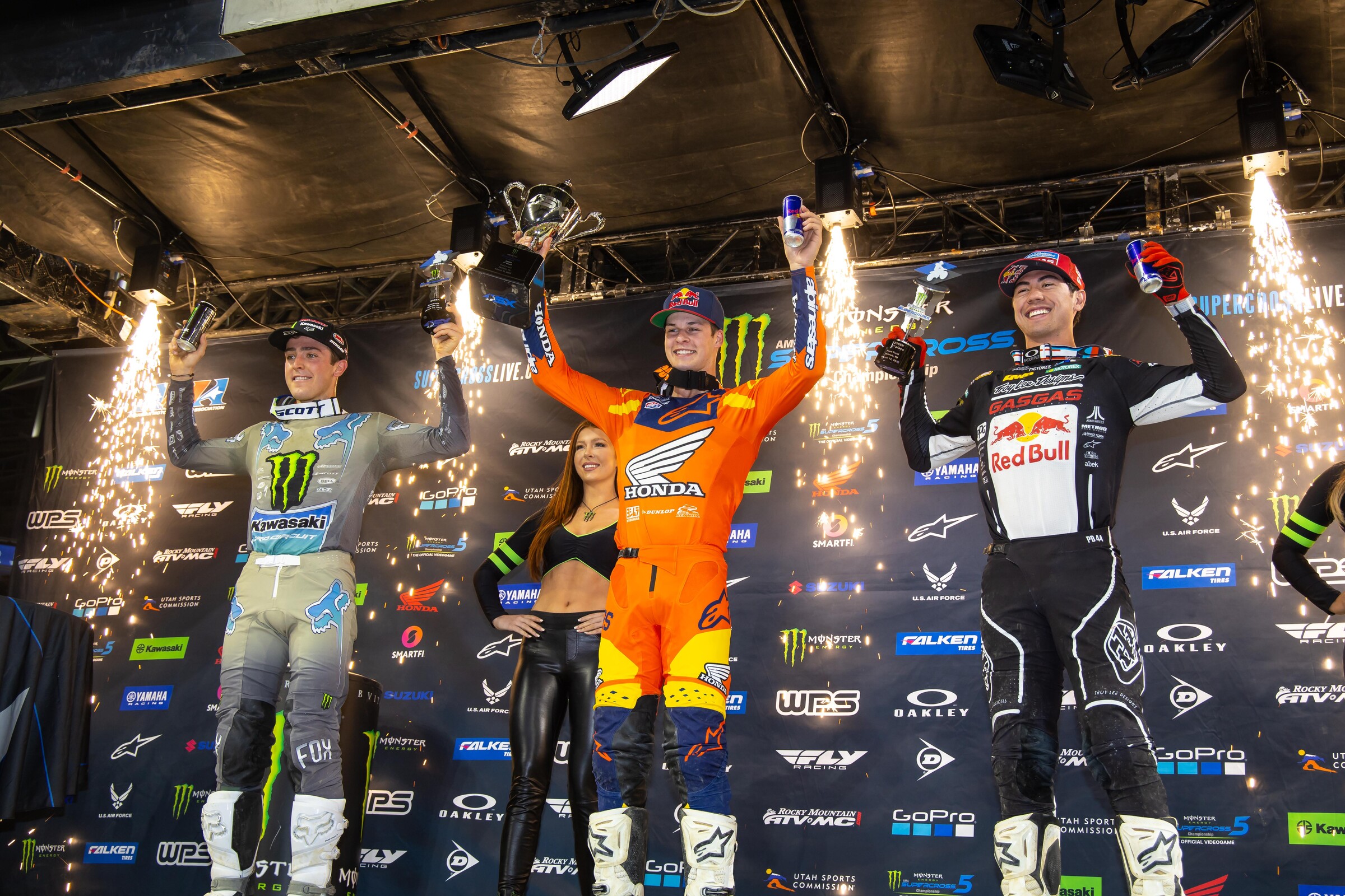 The 2022 Detroit Supercross 250SX podium: Jett Lawrence (center, first), Cameron McAdoo (left, second), and Pierce Brown (right, third).
