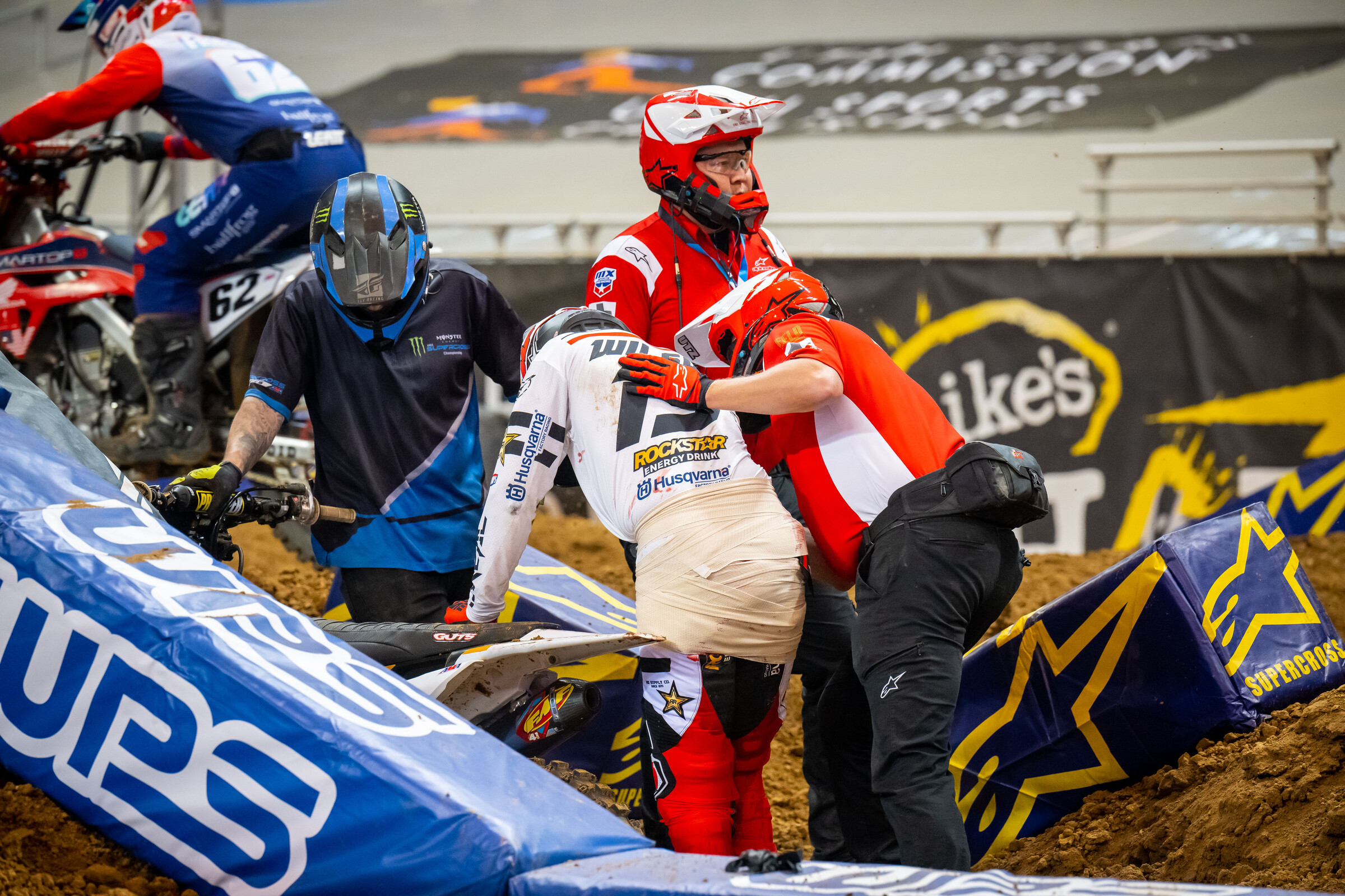 Dean Wilson received some pretty innovative bandaging on the track after taking a footpeg to his backside. 