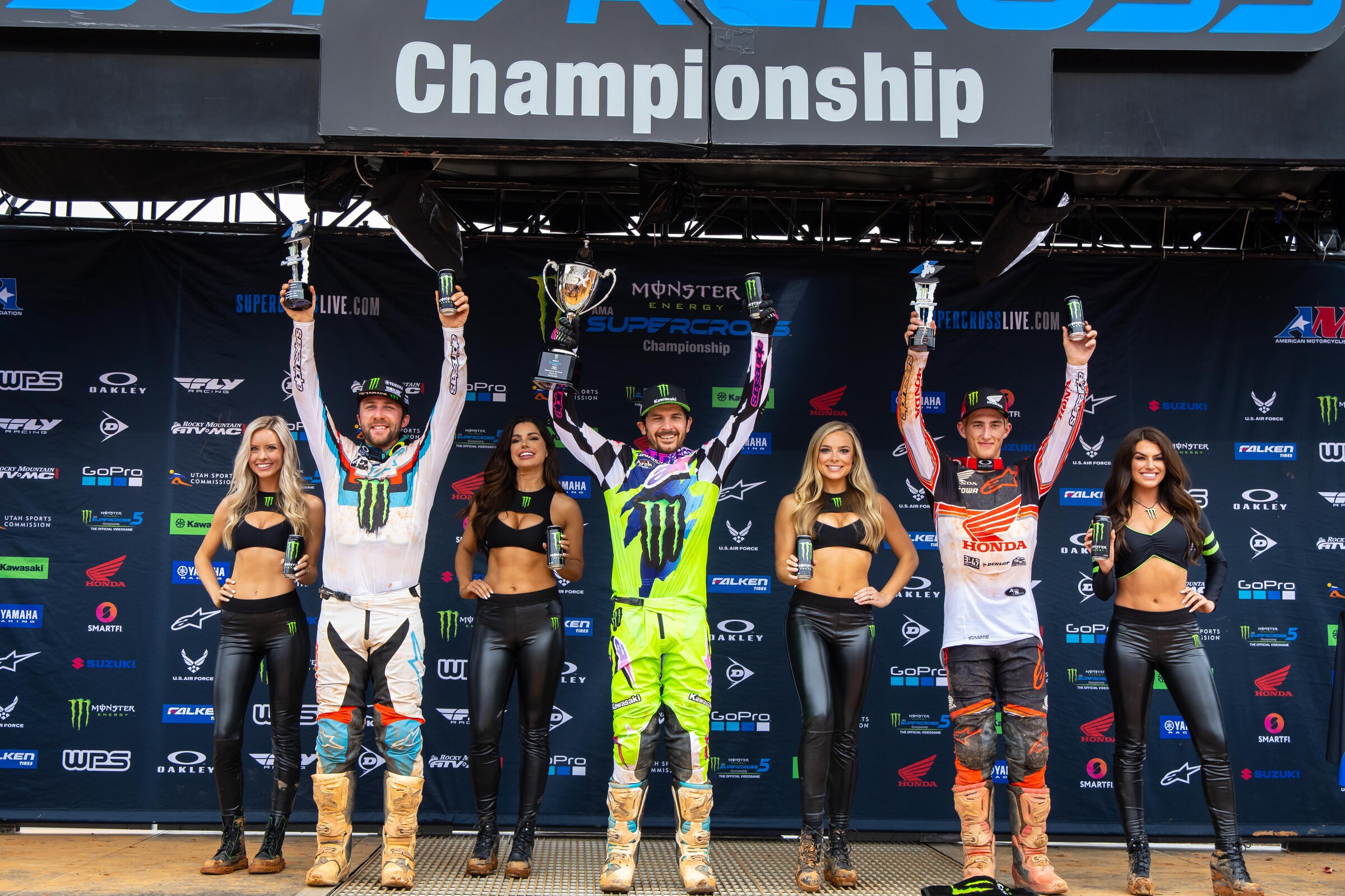 The 2022 Atlanta Supercross 450SX main event podium: Jason Anderson (center, first), Eli Tomac (left, second), and Chase Sexton (right, third).