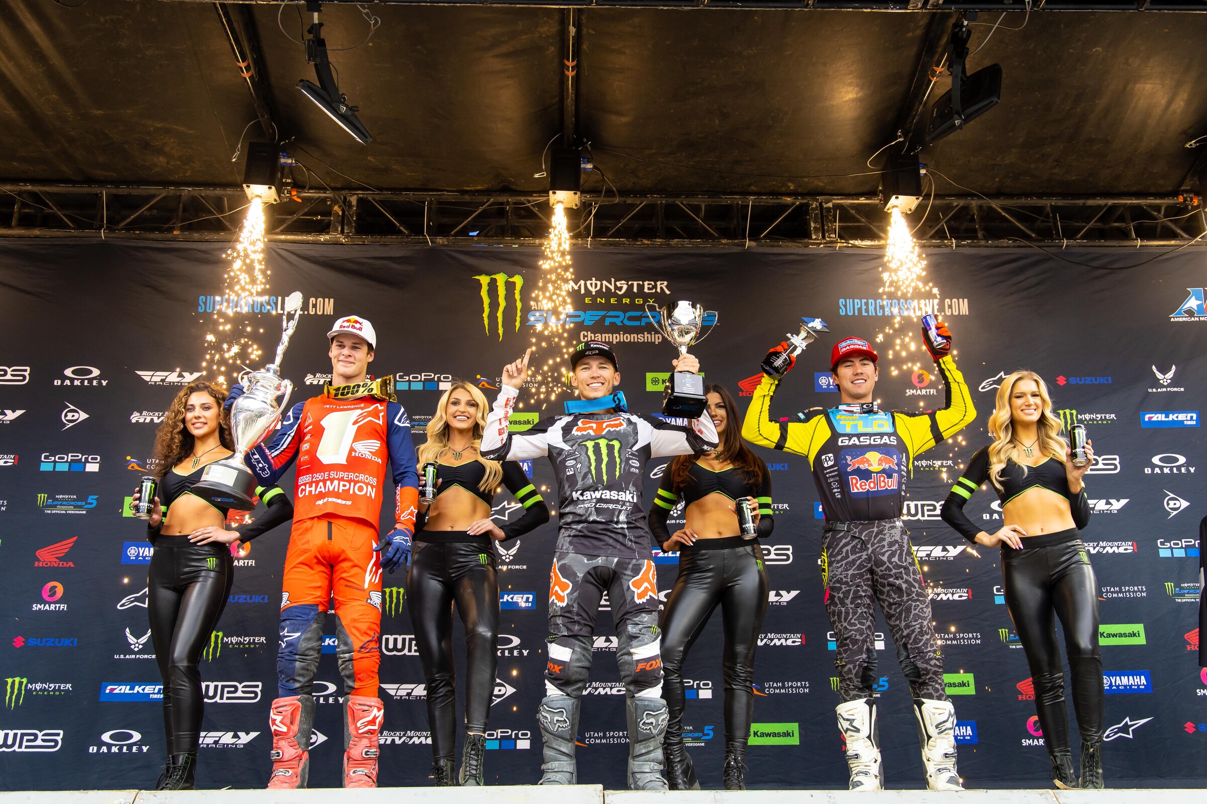 The 2022 Foxborough Supercross 250SX main event podium: Austin Forkner (center, first), Jett Lawrence (left, second), and Pierce Brown (right, third).