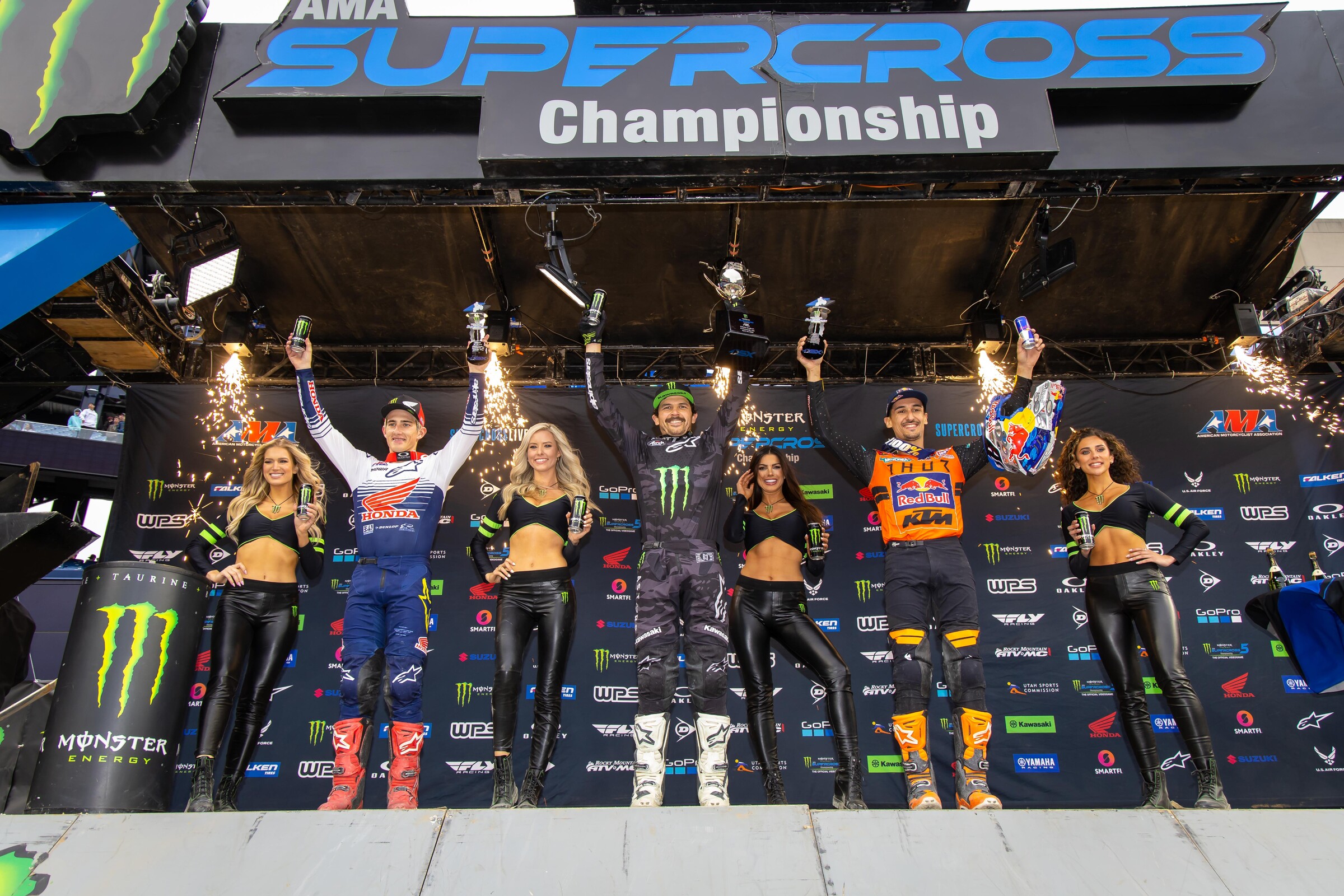 The 2022 Foxborough Supercross 450SX main event podium: Jason Anderson (center, first), Chase Sexton (left, second), and Marvin Musquin (right, third).