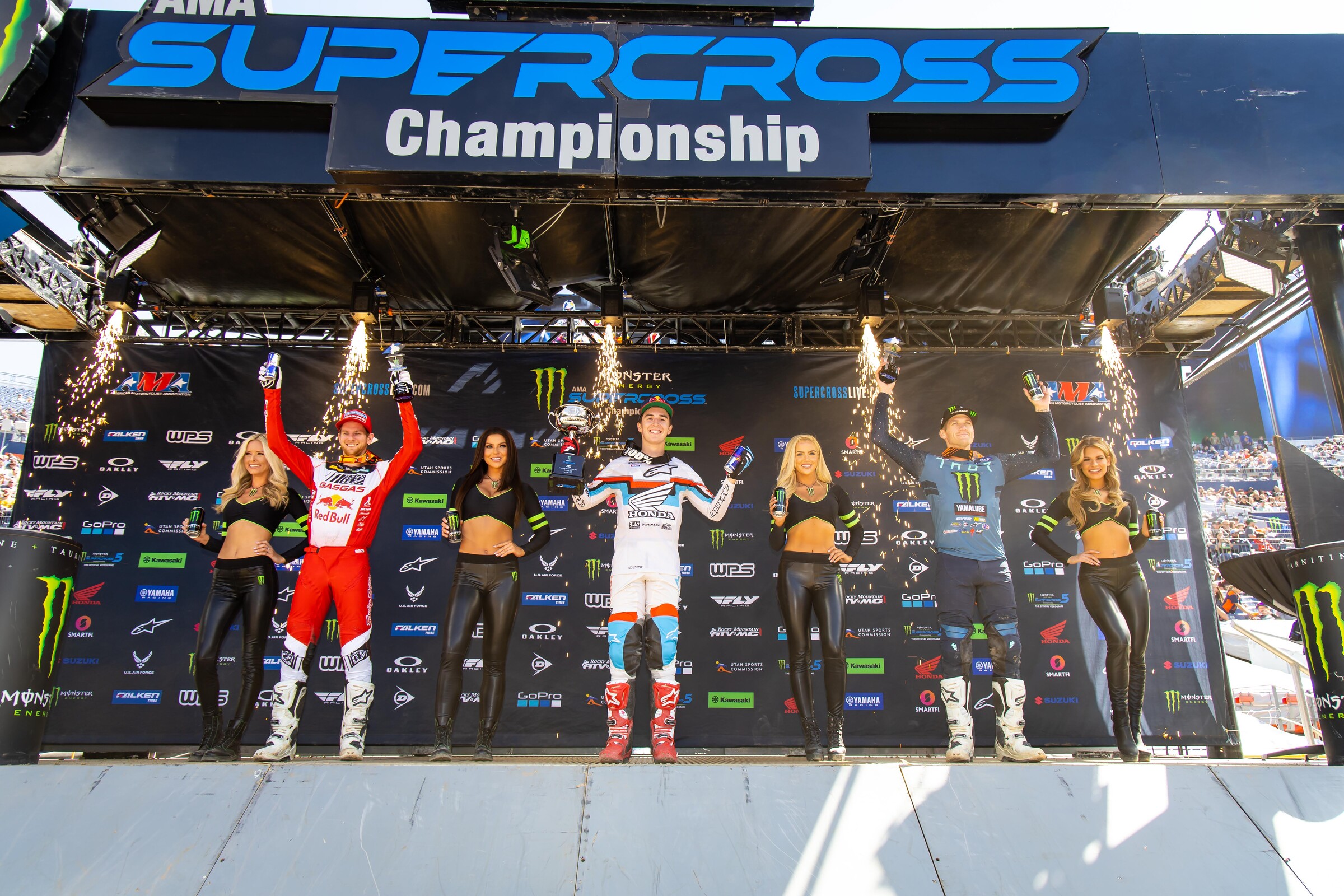 The 2022 Denver Supercross 250SX main event podium: Hunter Lawrence (center, first), Michael Mosiman (left, second), and Christian Craig (right, third).