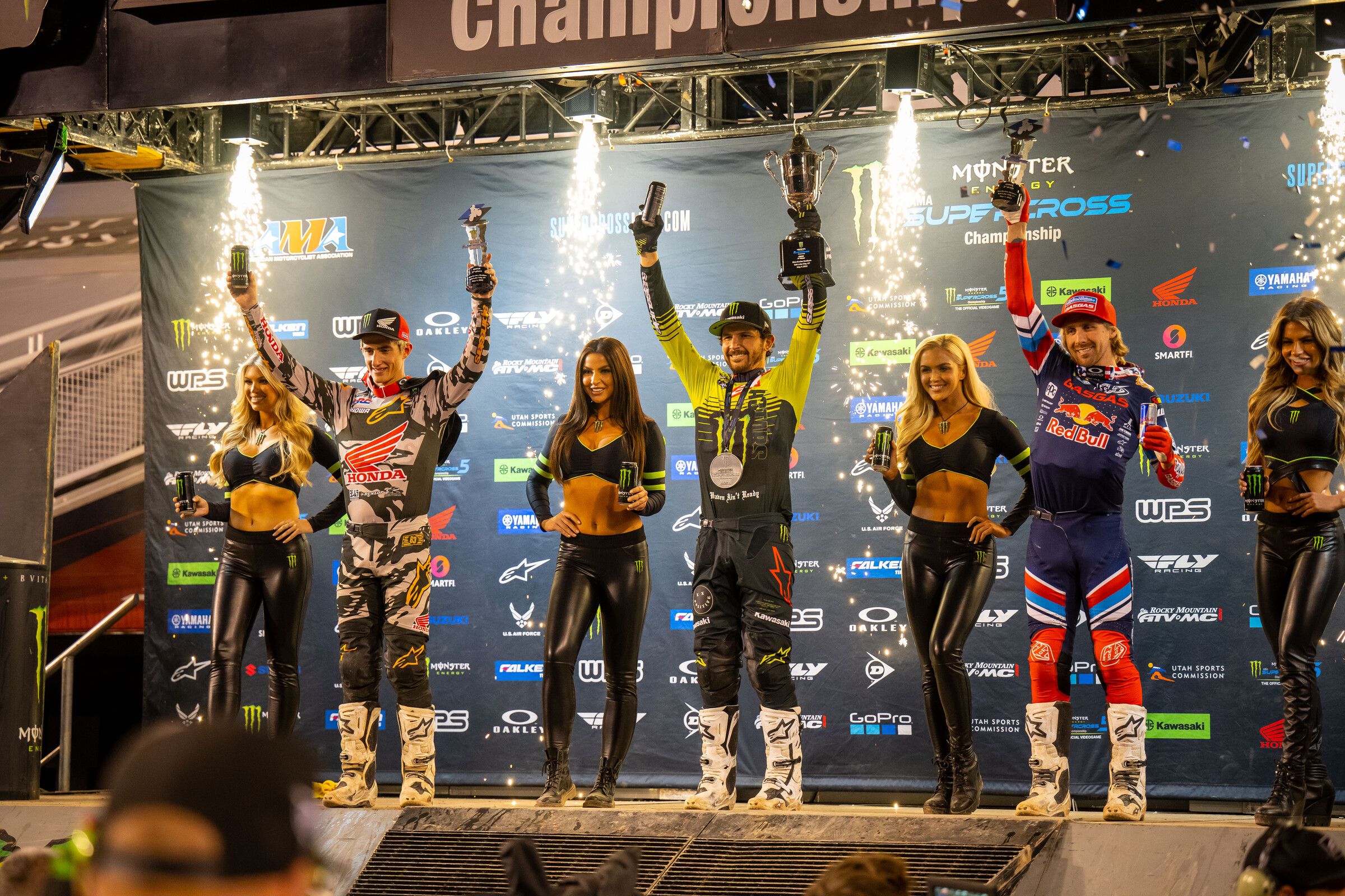 The 450SX main event podium: Jason Anderson (center, first), Chase Sexton (left, second), and Justin Barcia (right, third).