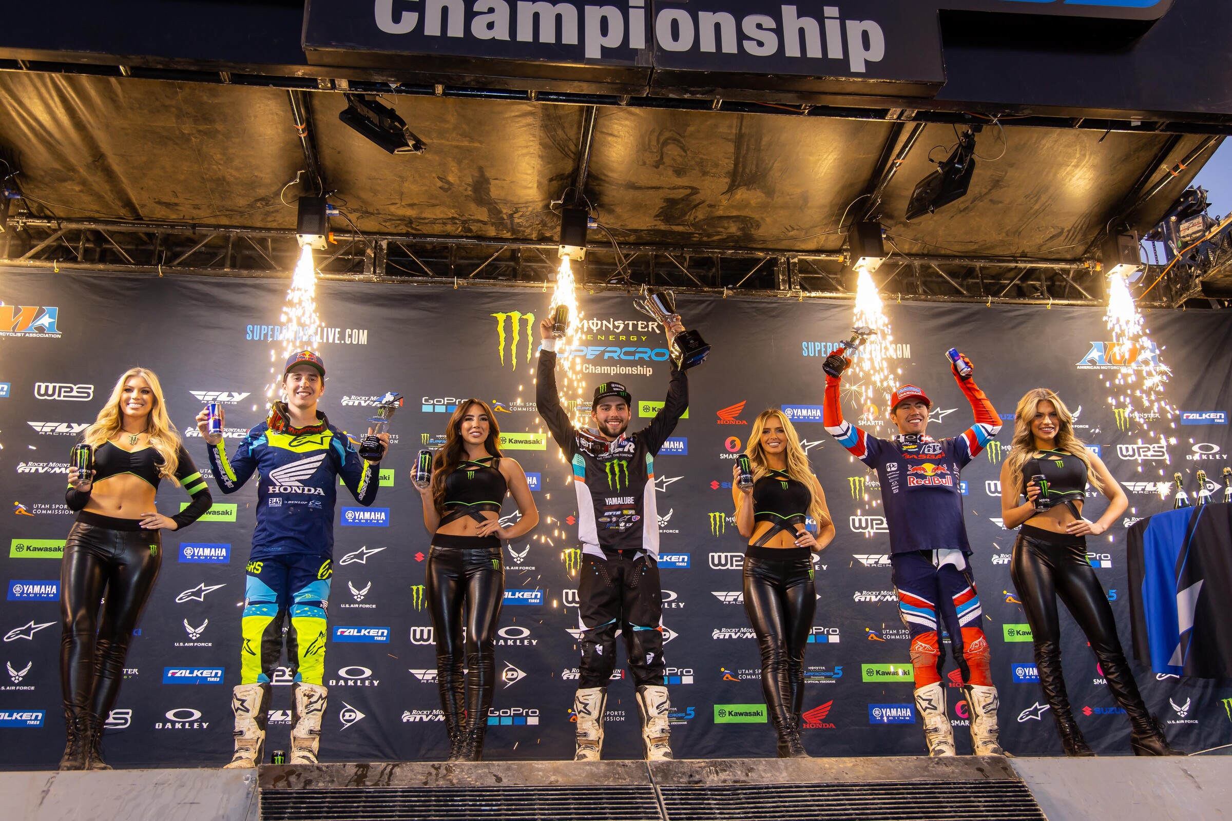 The Dave Coombs Sr. East/West Showdown main event podium: Nate Thrasher (center, first), Hunter Lawrence (left, second), and Pierce Brown (right, third).