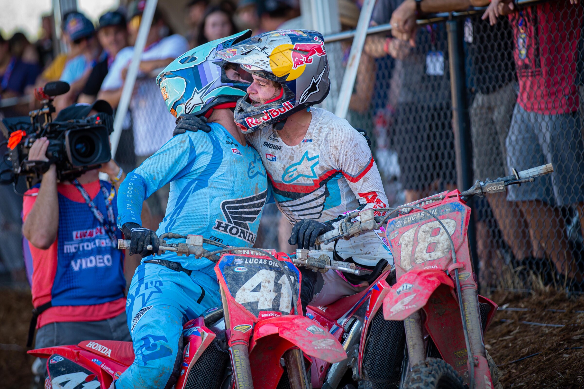 Brothers Hunter and Jett Lawrence embrace after the final moto of the 2021 Lucas Oil AMA Pro Motocross Championship as Jettson clinched the 250 Class title.
