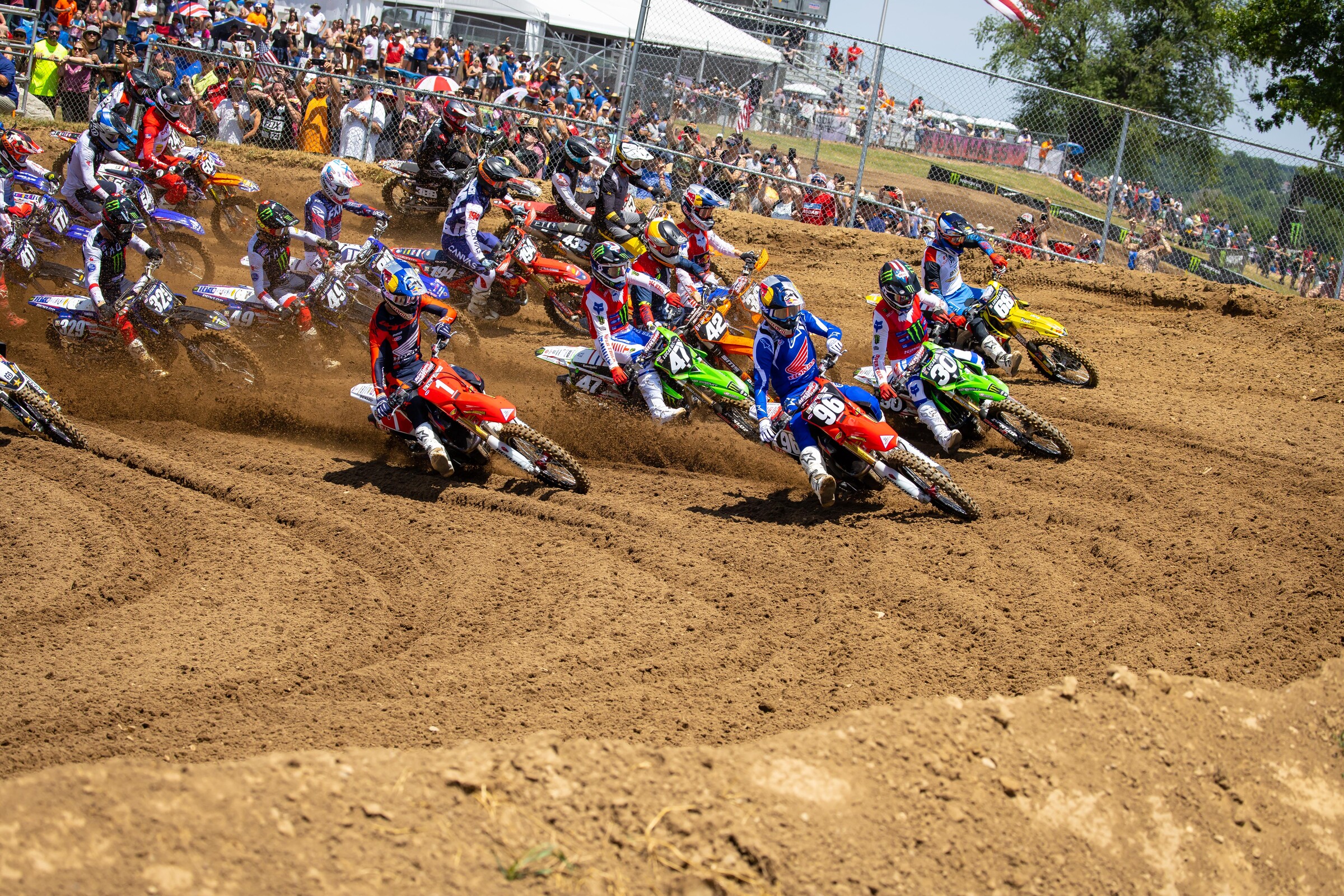Hunter and Jett Lawrence leading the 250 Class into the first turn of moto one.