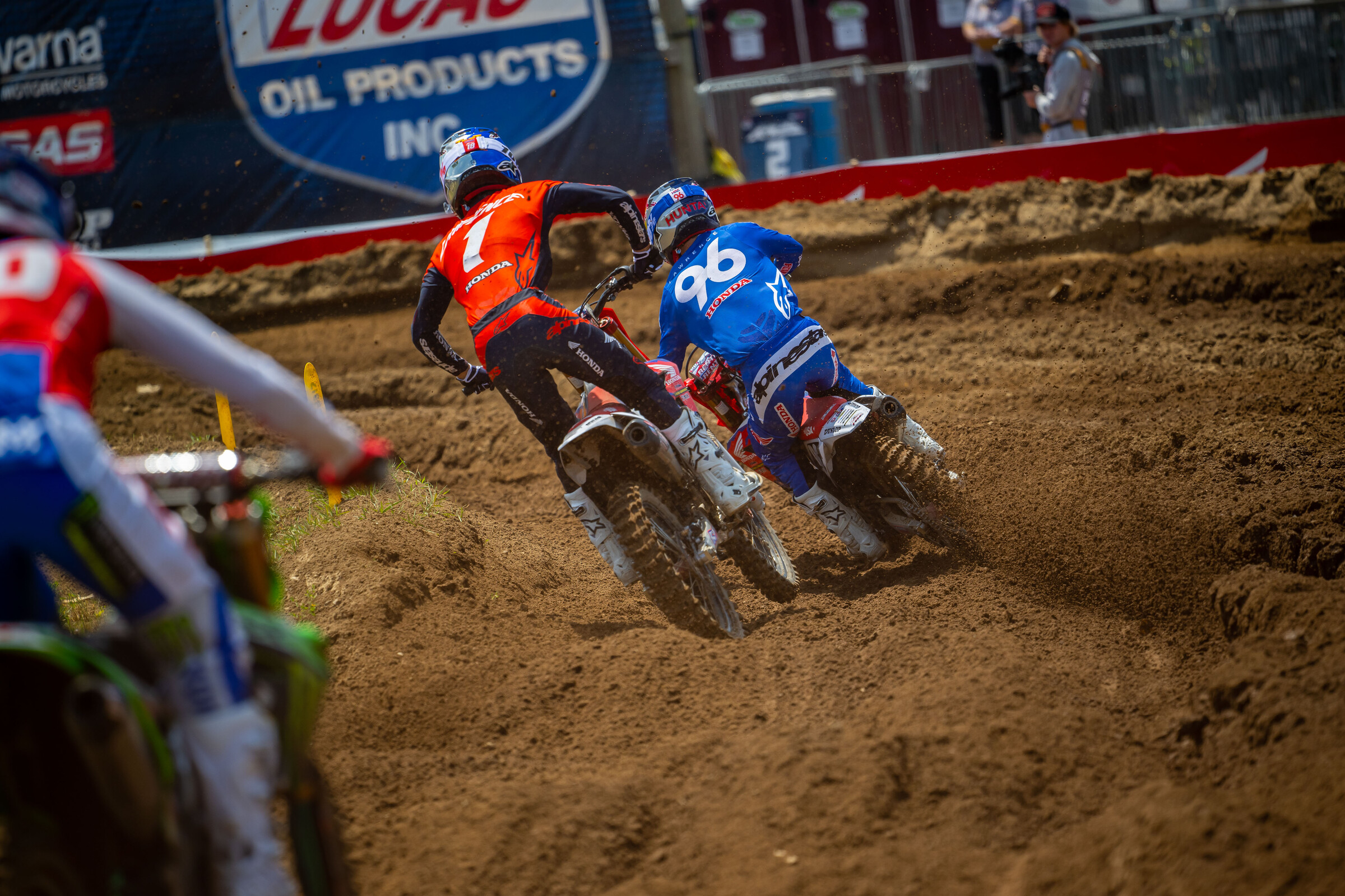 Hunter Lawrence leads his brother Jett in the first moto, with Jo Shimoda following closely.
