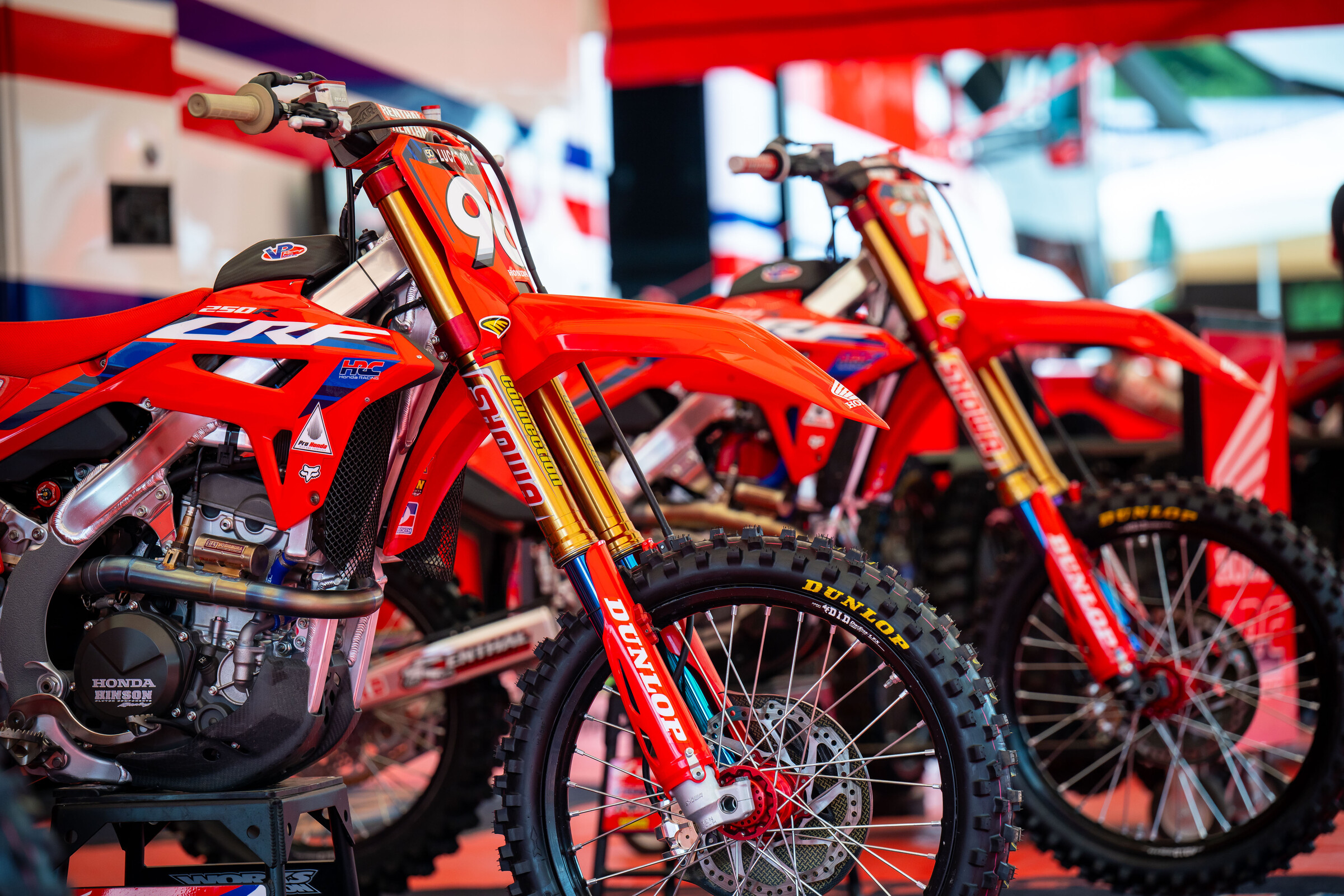 Hunter Lawrence's Honda CRF250R next to Chase Sexton's Honda CRF450R.