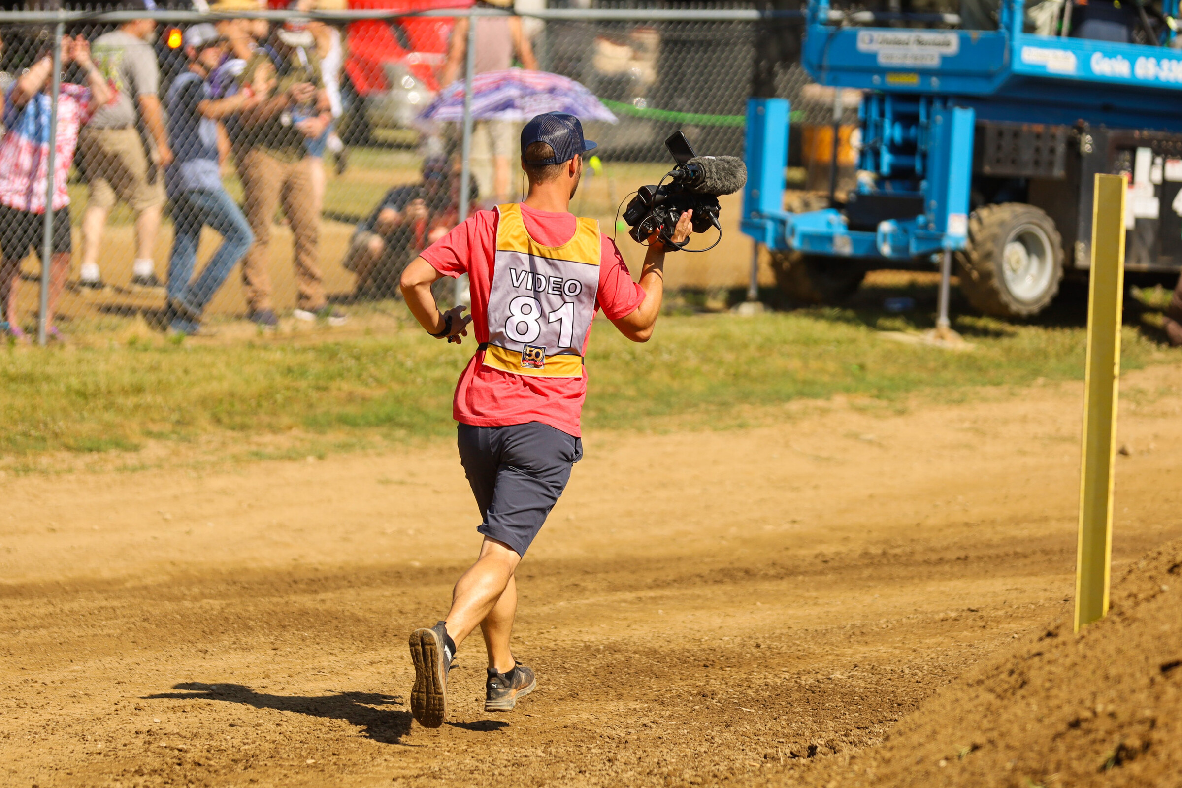 Williams running to get shots mid-moto during the 2022 RedBud National in July.