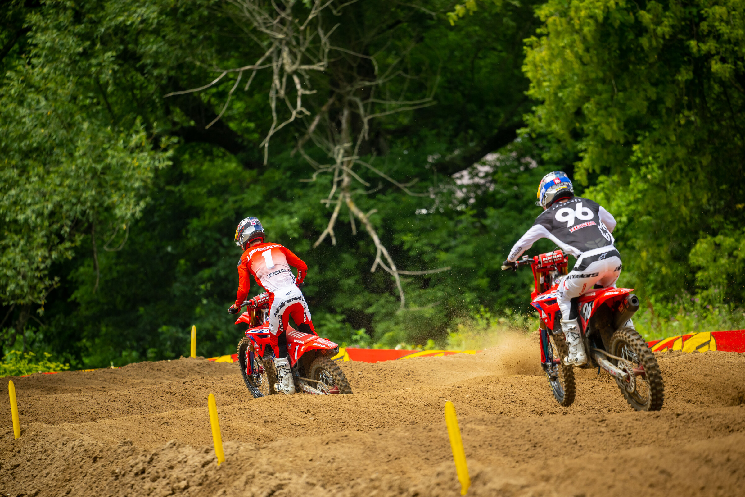 Jett Lawrence leads his brother Hunter through the sand whoops.