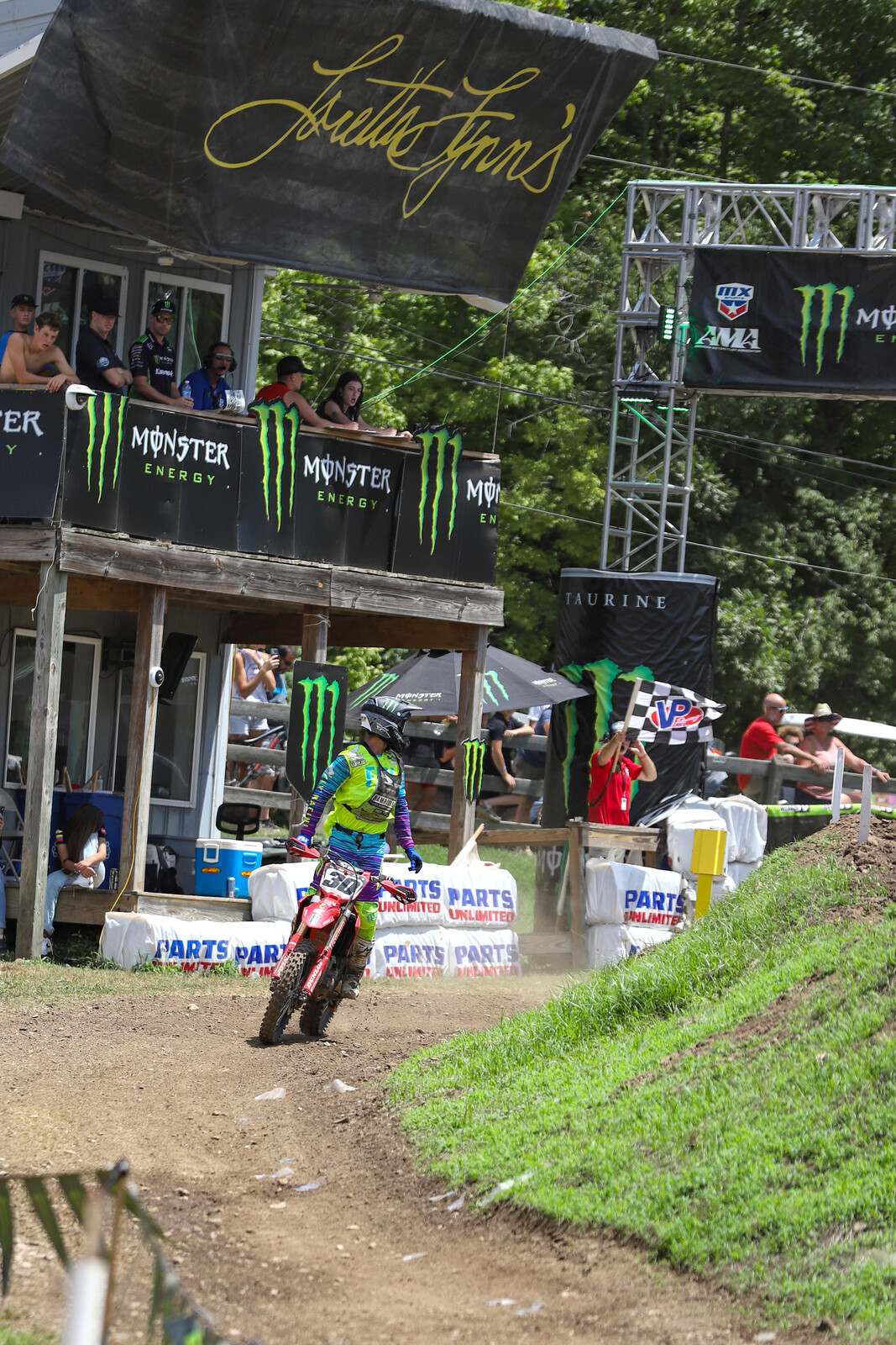 Martinez taking the checkered flag and looking back in disbelief after claiming the final Open Pro Sport moto of the week and the class overall win!