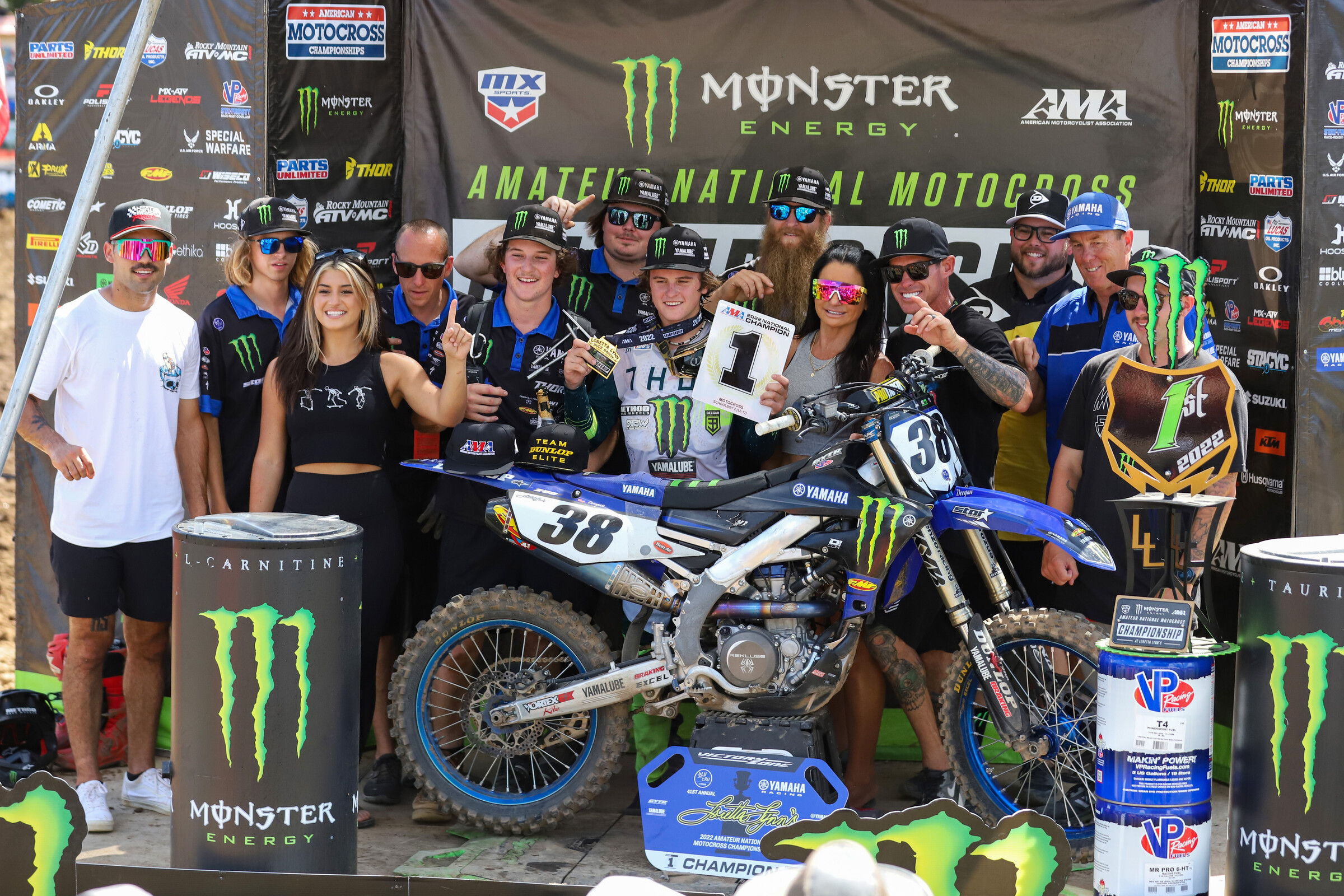 The Monster Energy Yamaha Star Racing team and the Deegans celebrating Haiden's title.