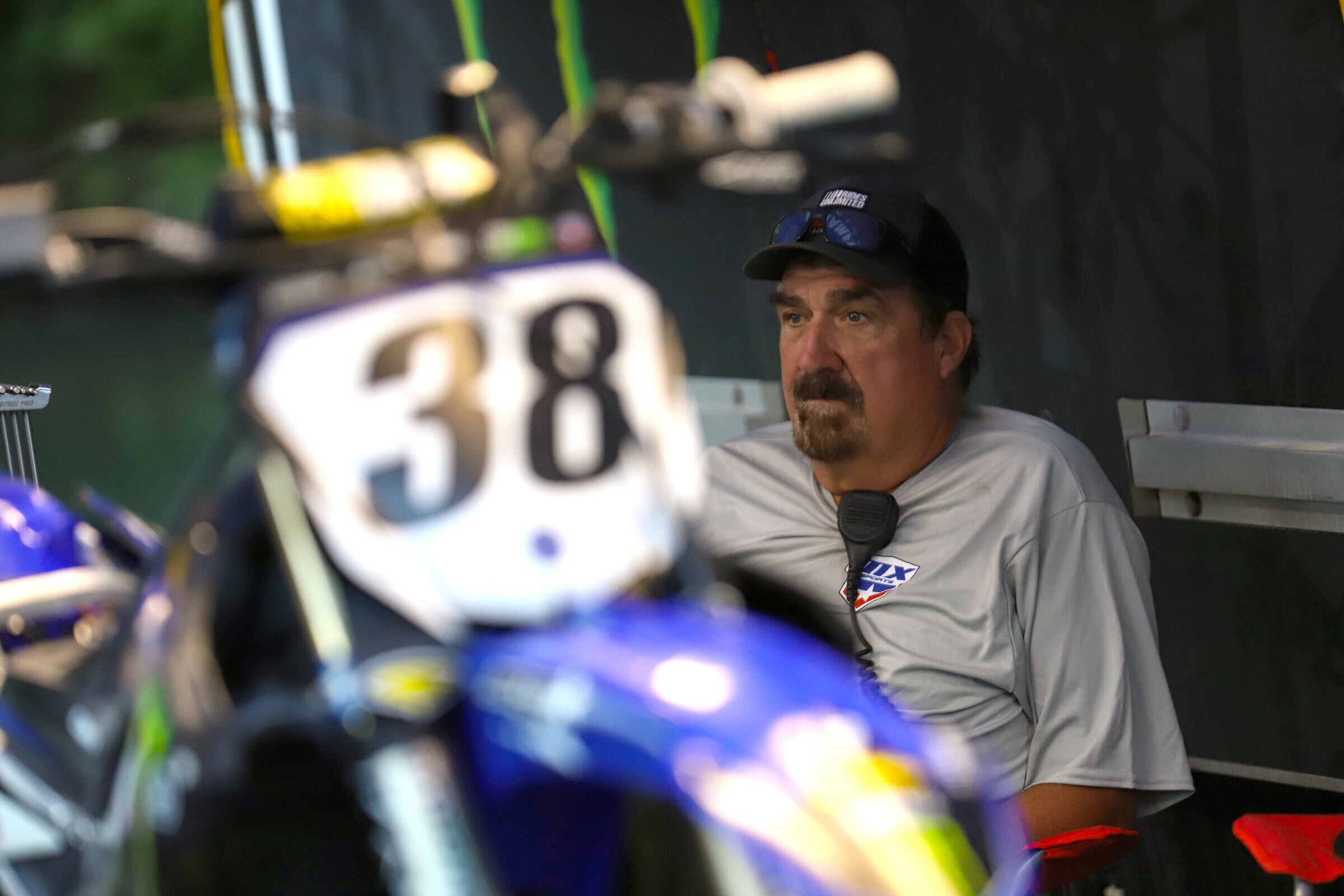John Knox sits with Haiden Deegan's bike on Friday evening.