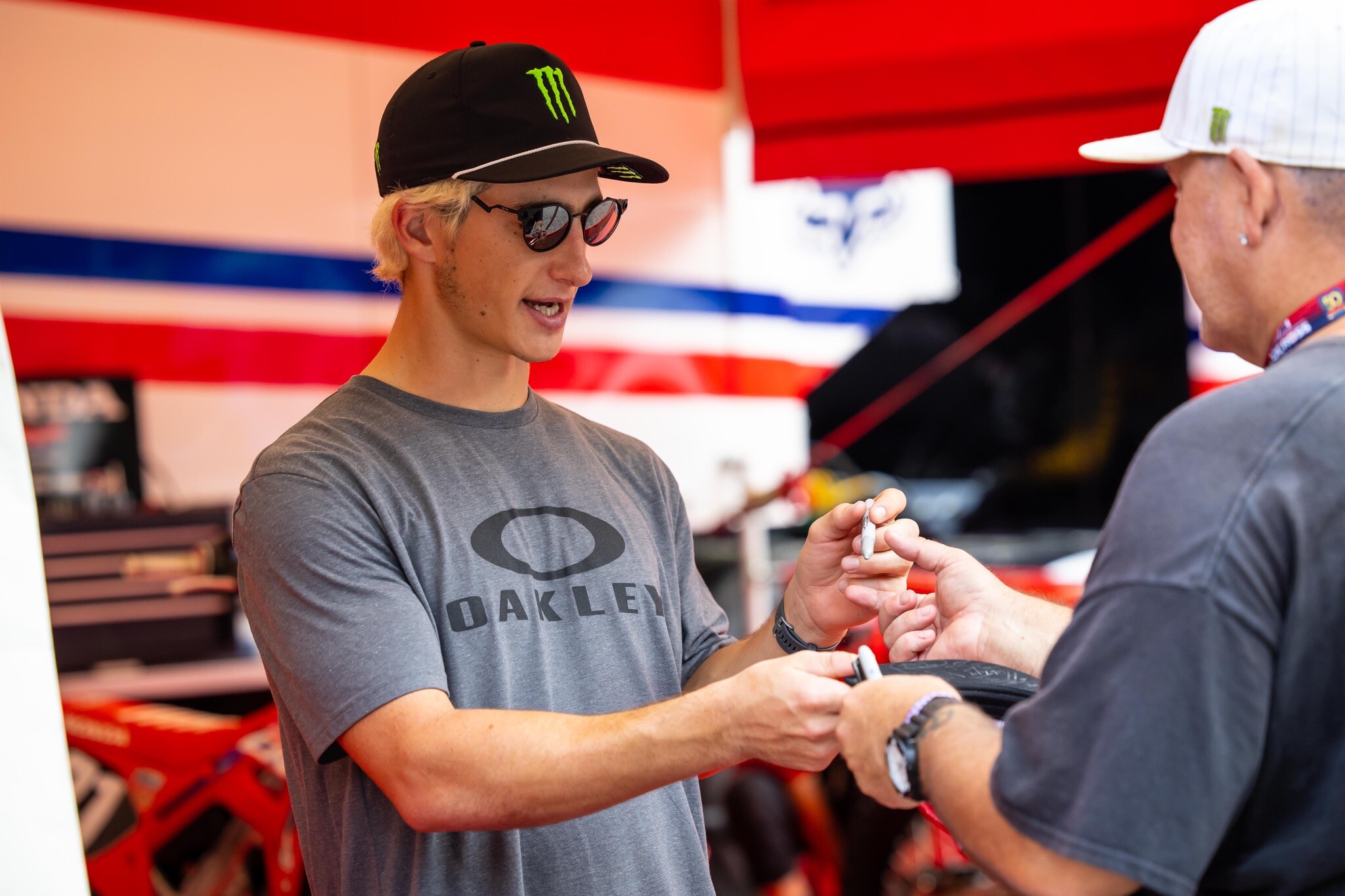 Chase Sexton signing autographs on Friday.