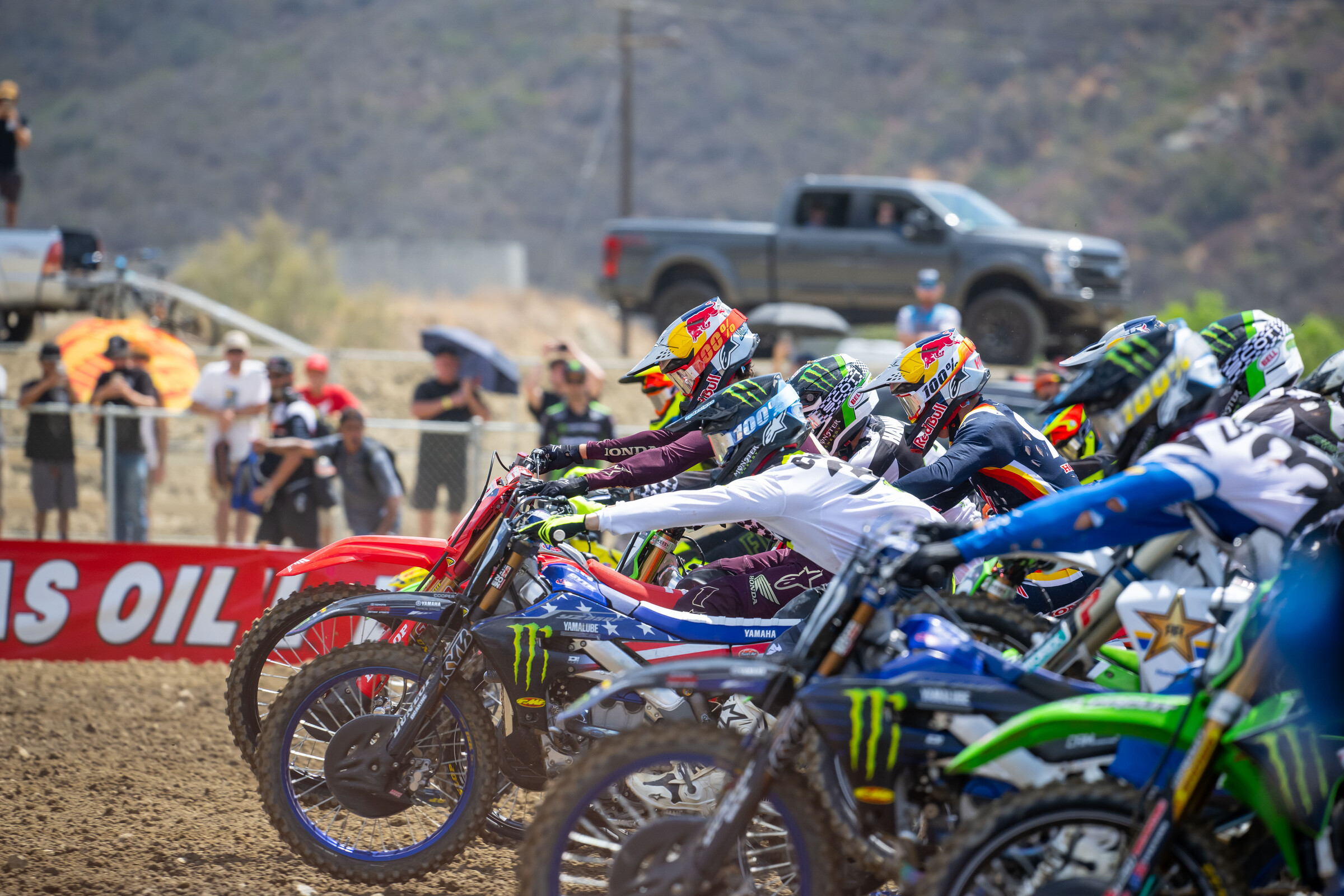Justin Cooper and Jett Lawrence poking out in front of the field off the start.