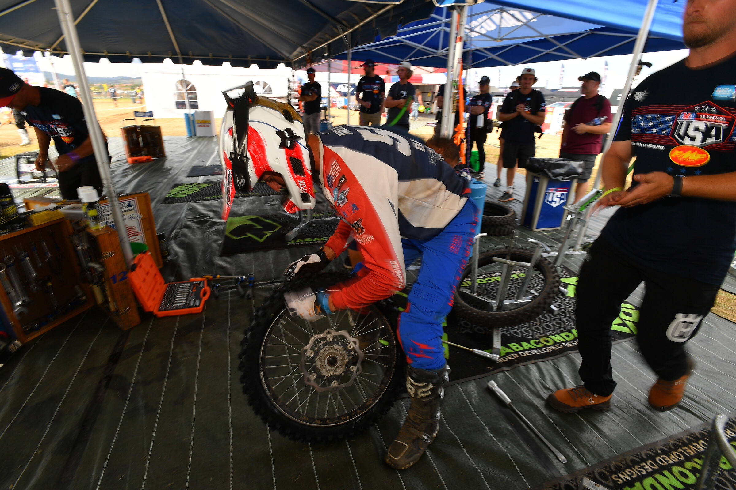 All riders at ISDE have to do their own bike work, here Aiello changes his tire.