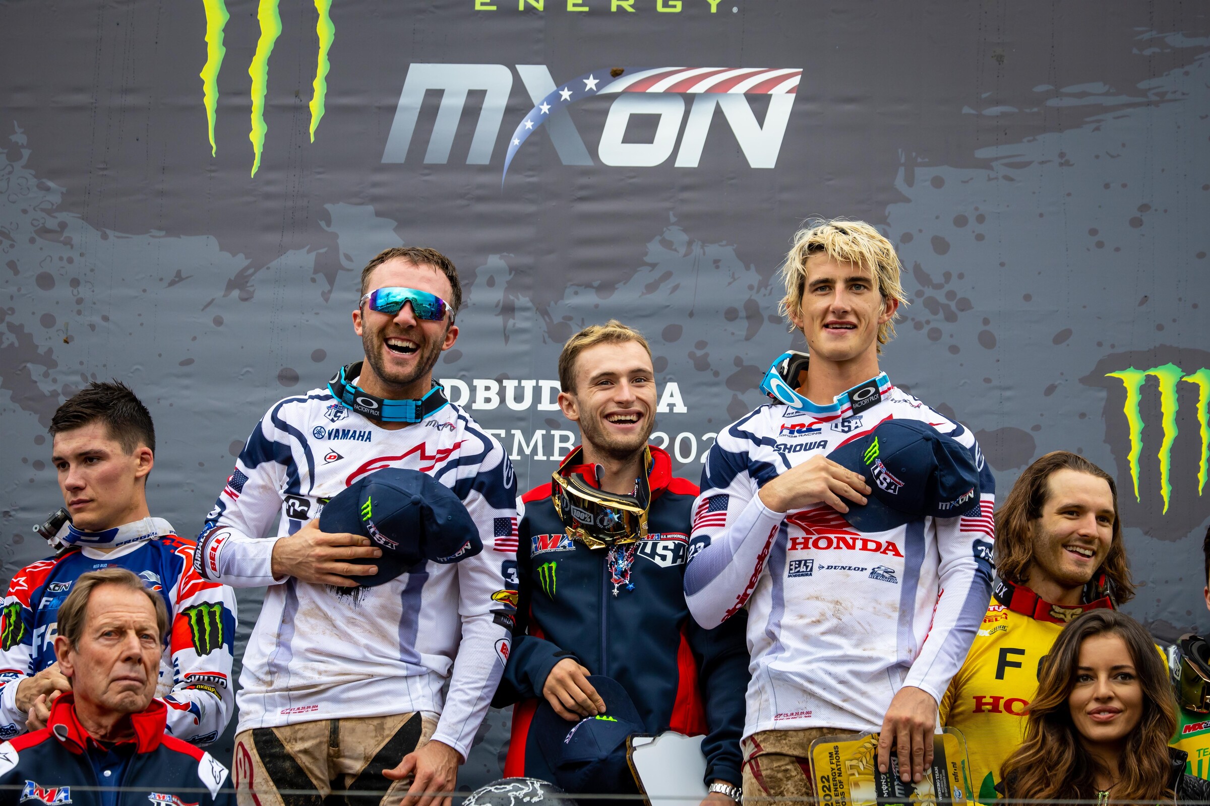 Eli Tomac, Justin Cooper, and Chase Sexton as the Star Spangled Banner plays.