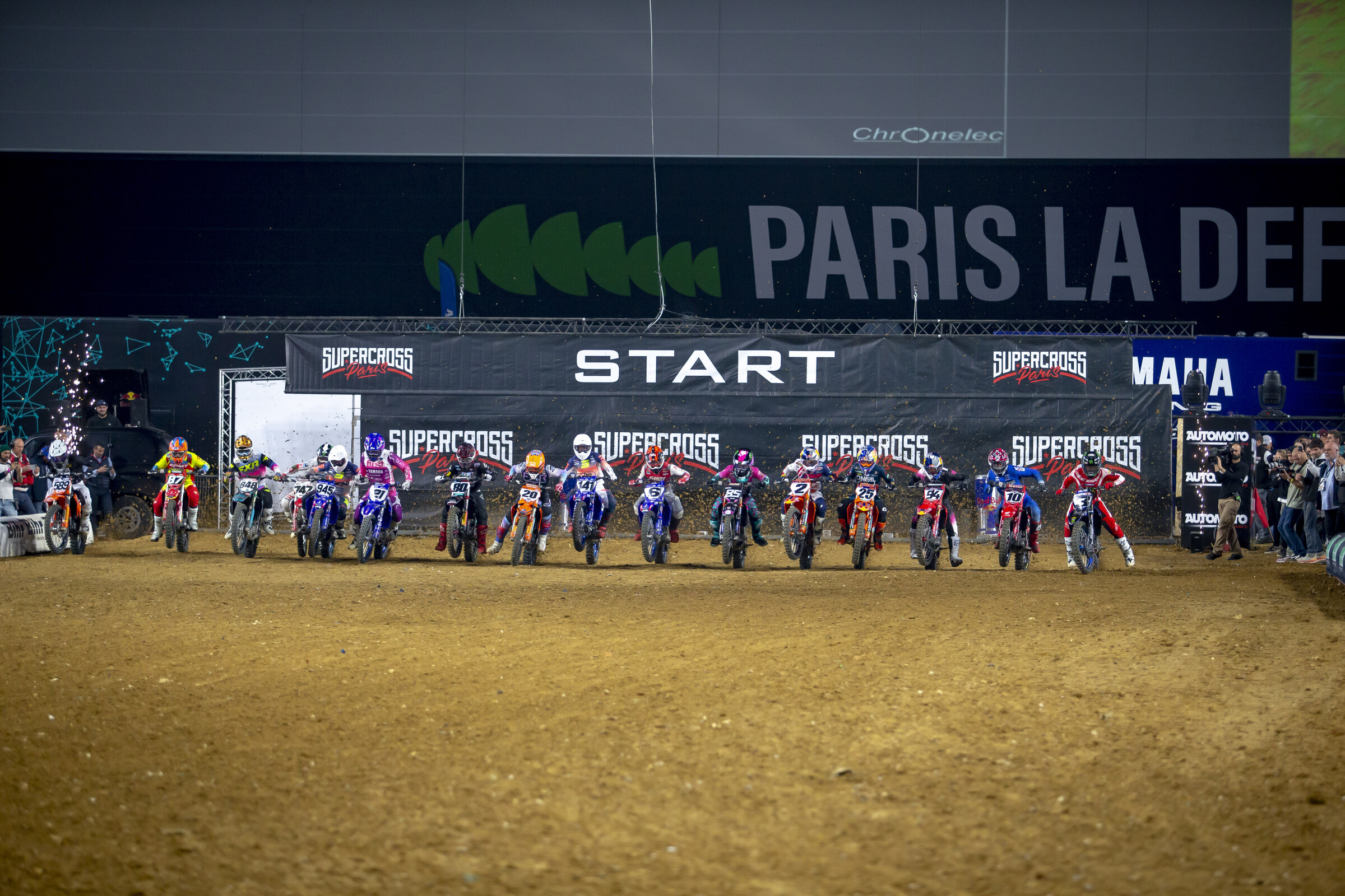 Riders launching out of the gate in the first night of racing at Paris.