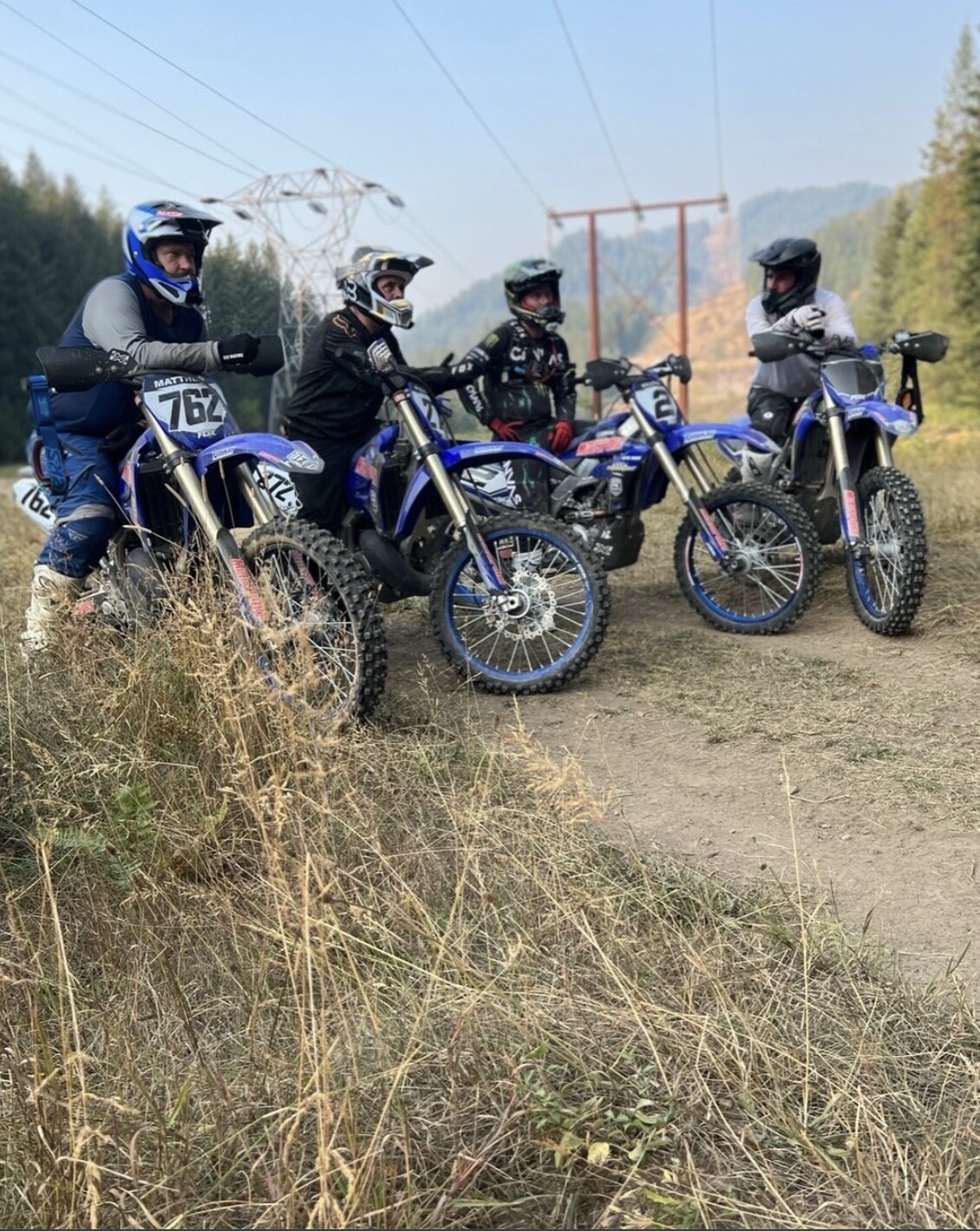 Steve Matthes, Sullivan, Villopoto, and Weimer take a quick break before heading back onto the trail.