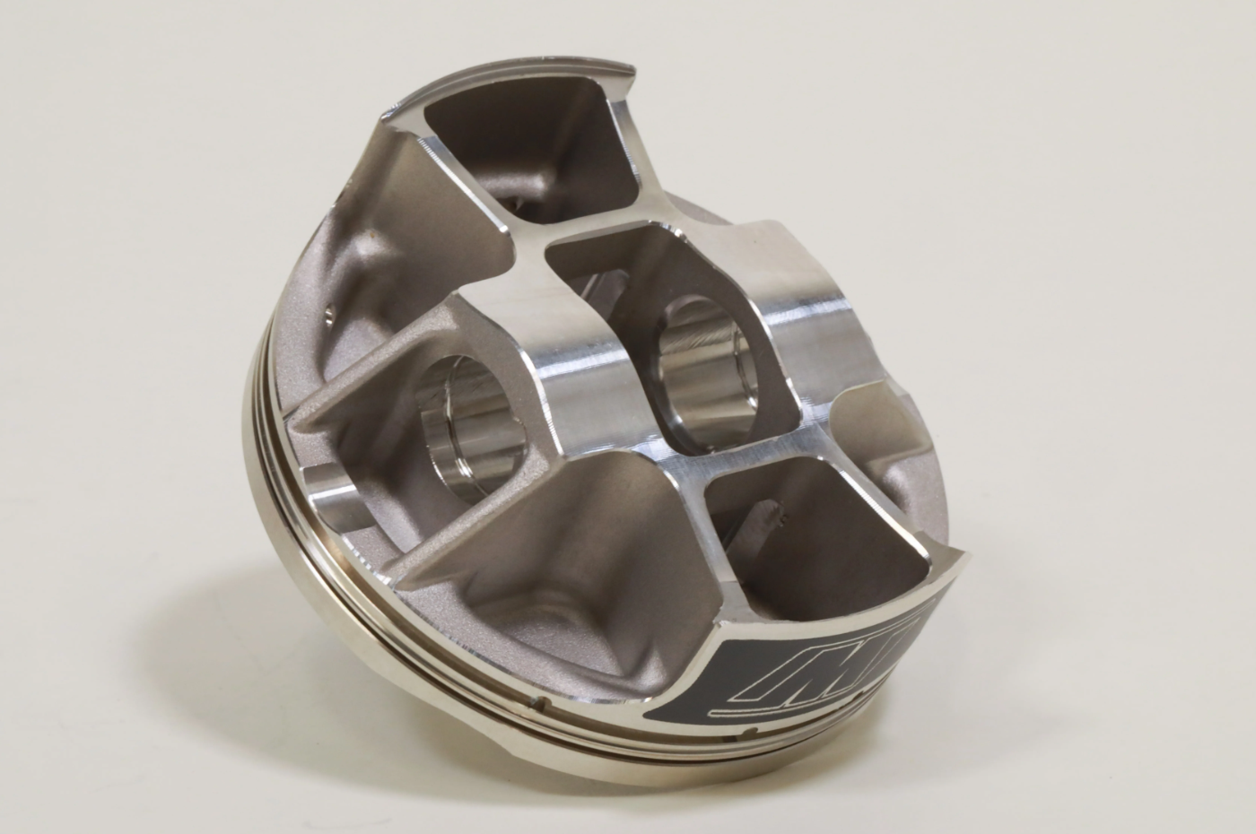 Revised forging and finished piston with updated boxed and strutted design to maximize strength needed for the high-performance nature of KTM, Husqvarna and GASGAS engines without compromising lightweight characteristics. 